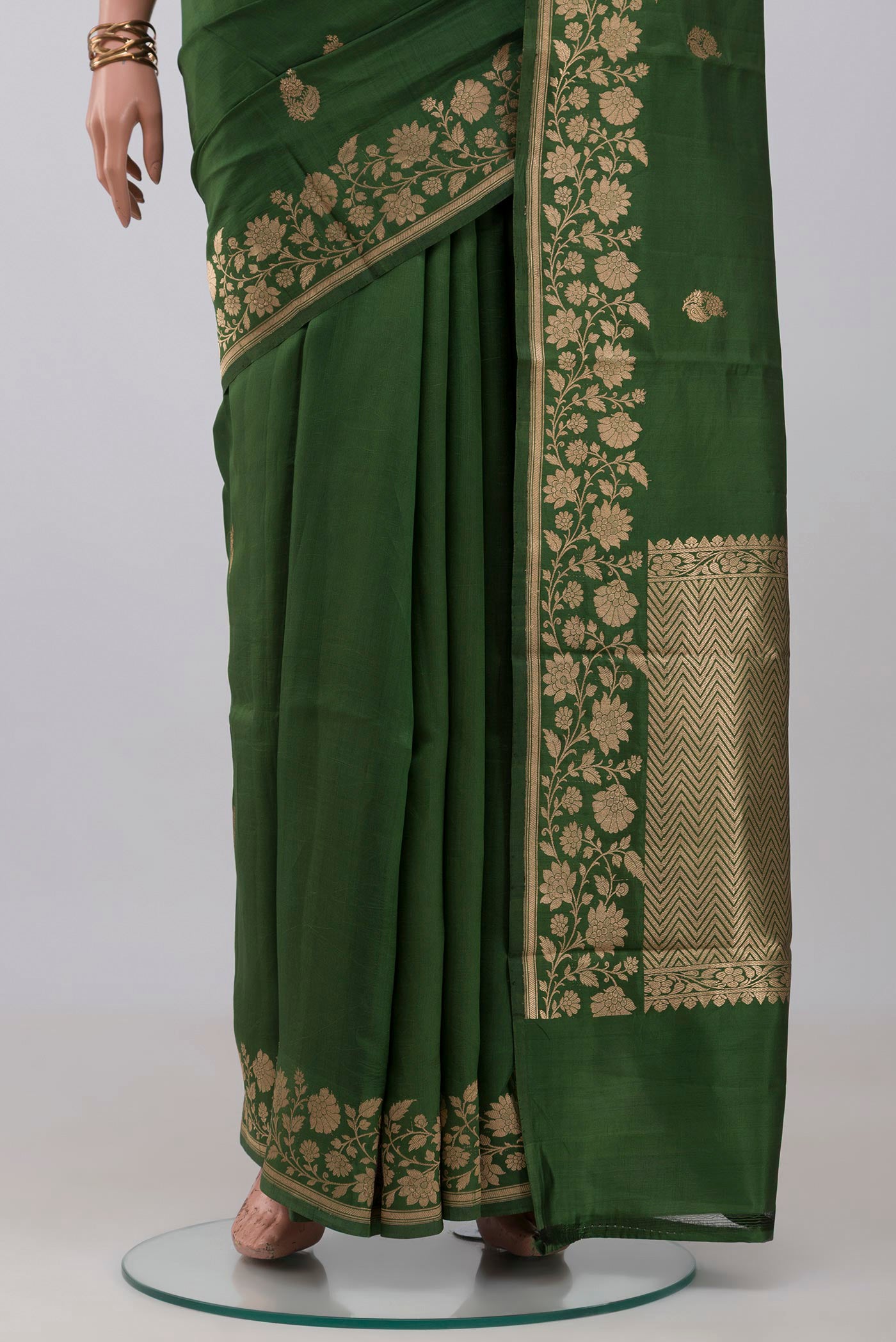 Pleats and pallu of Green Banarasi Katan Silk Saree with Zari Butta on the body and Fancy Border. 