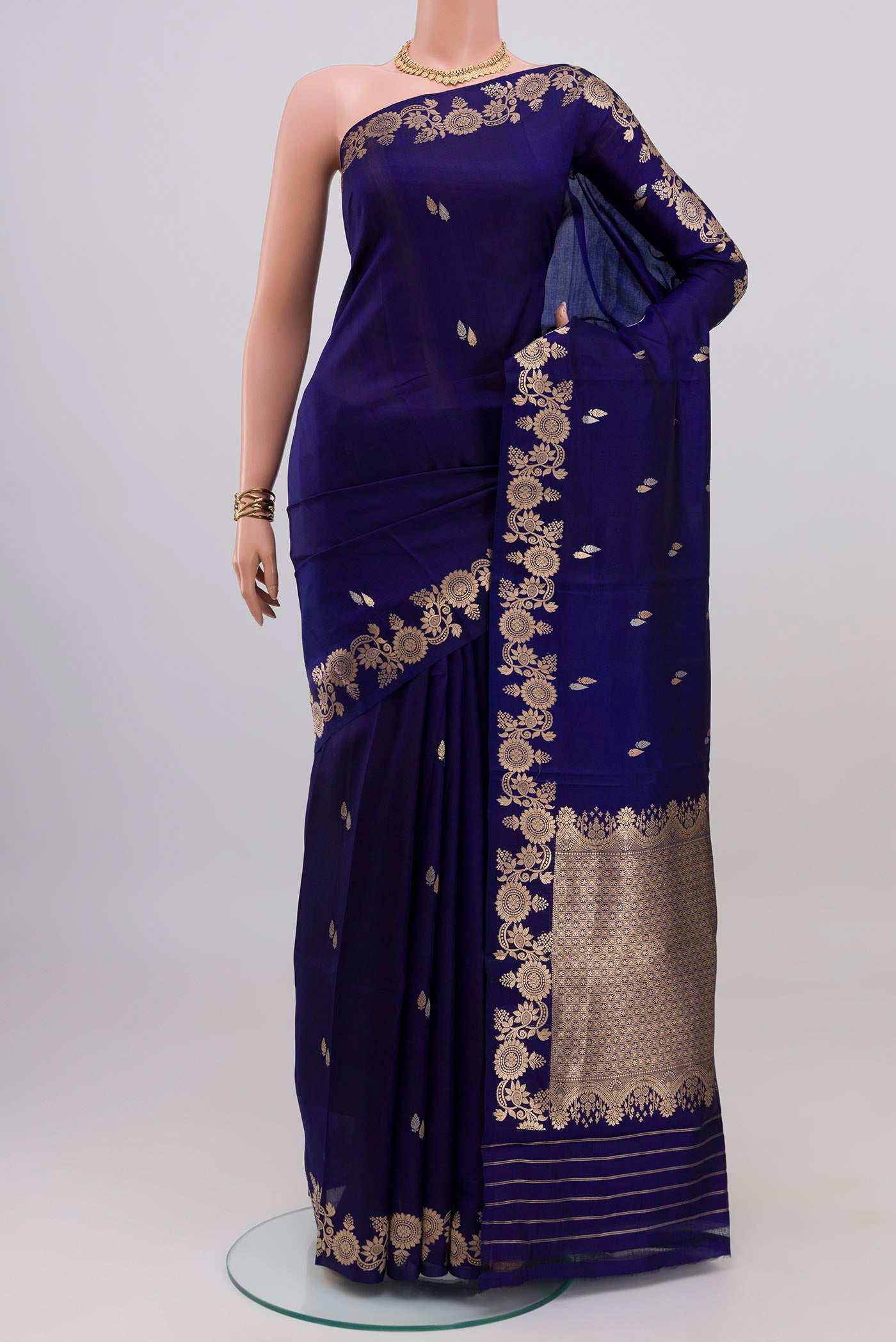 Blue Banarasi Katan Silk Saree with Zari Butta on the body and Fancy Border.  displayed on a mannequin