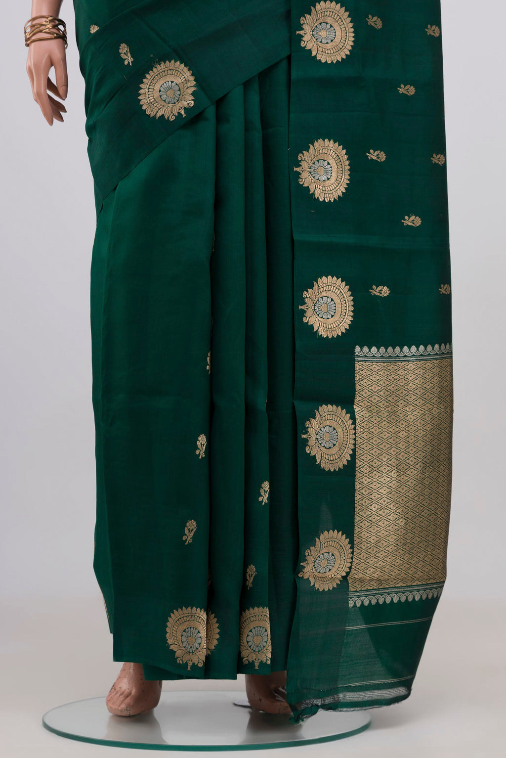 Pleats and pallu of Bottle Green Banarasi Katan Silk Saree with Zari Butta on the body and Fancy Border. 