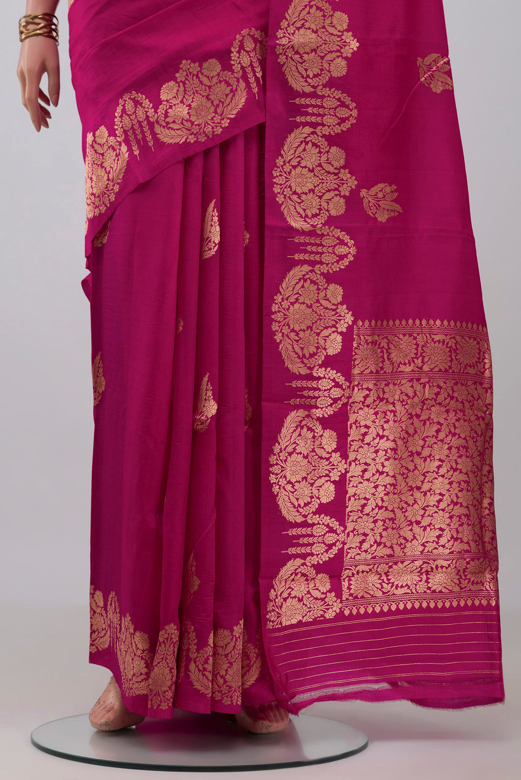 Pleats and pallu of Rani Pink Banarasi Katan Silk Saree with Zari Butta on the body and Fancy Border. 