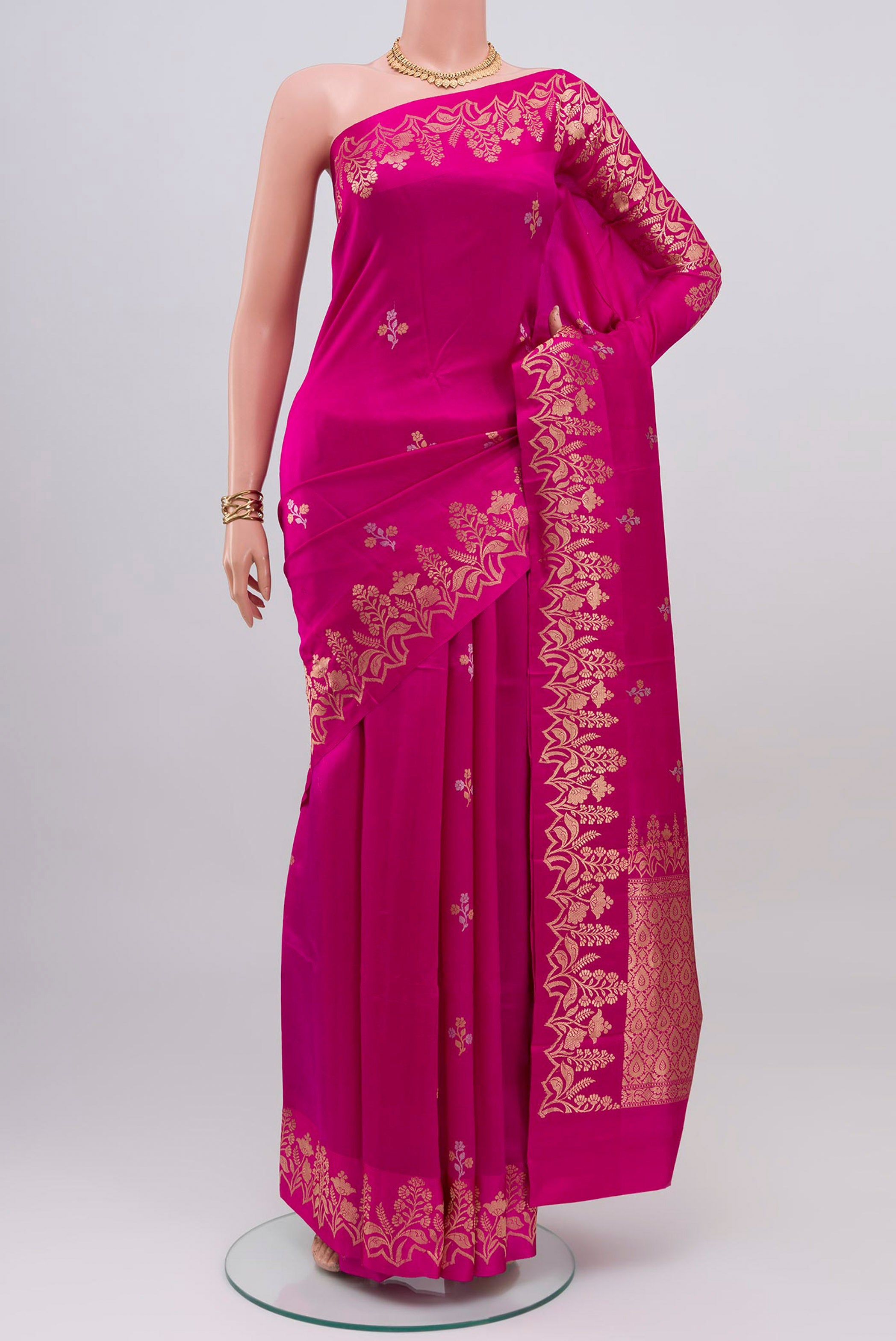 Pink Banarasi Katan Silk Saree with Zari Butta on the body and Fancy Border.  displayed on a mannequin