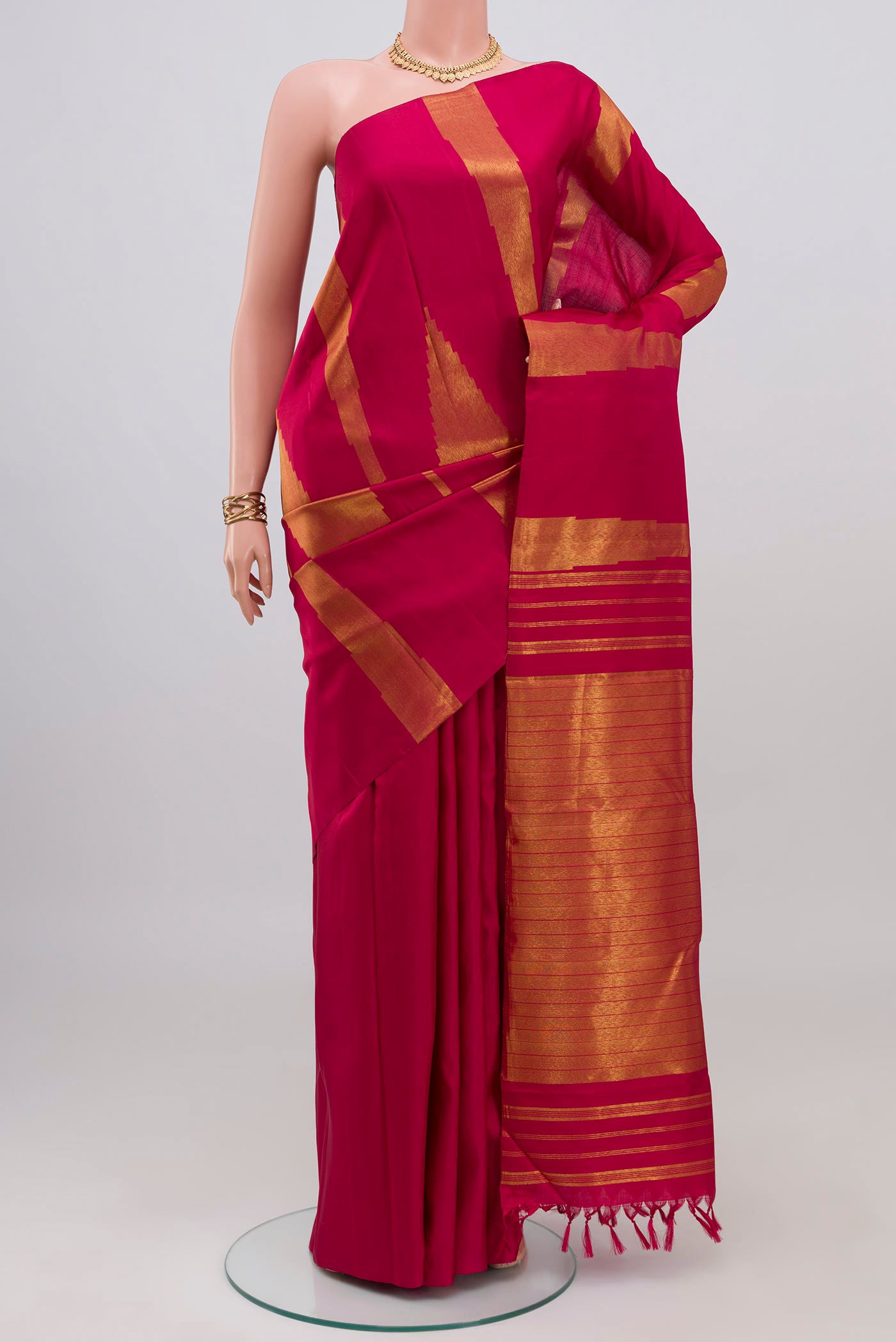 Pure Silk Pure Zari Maroon Kanjivaram Saree with Fancy on the body and Rising Temple Border.  displayed on a mannequin