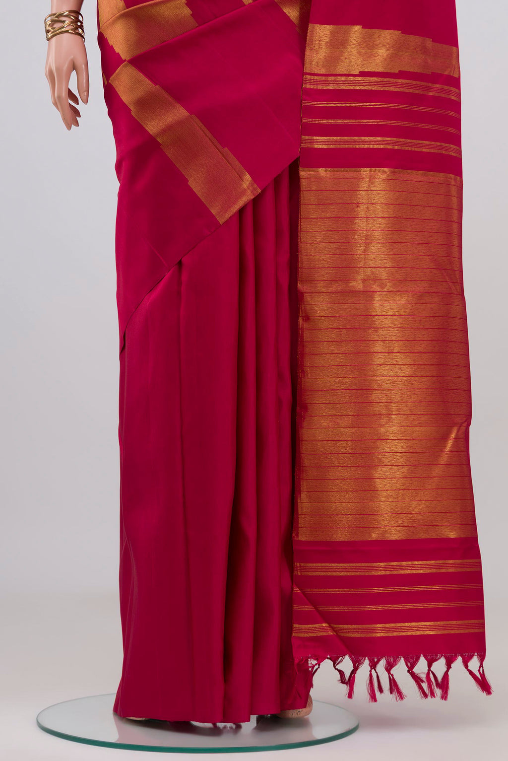 Pleats and pallu of Pure Silk Pure Zari Maroon Kanjivaram Saree with Fancy on the body and Rising Temple Border. 