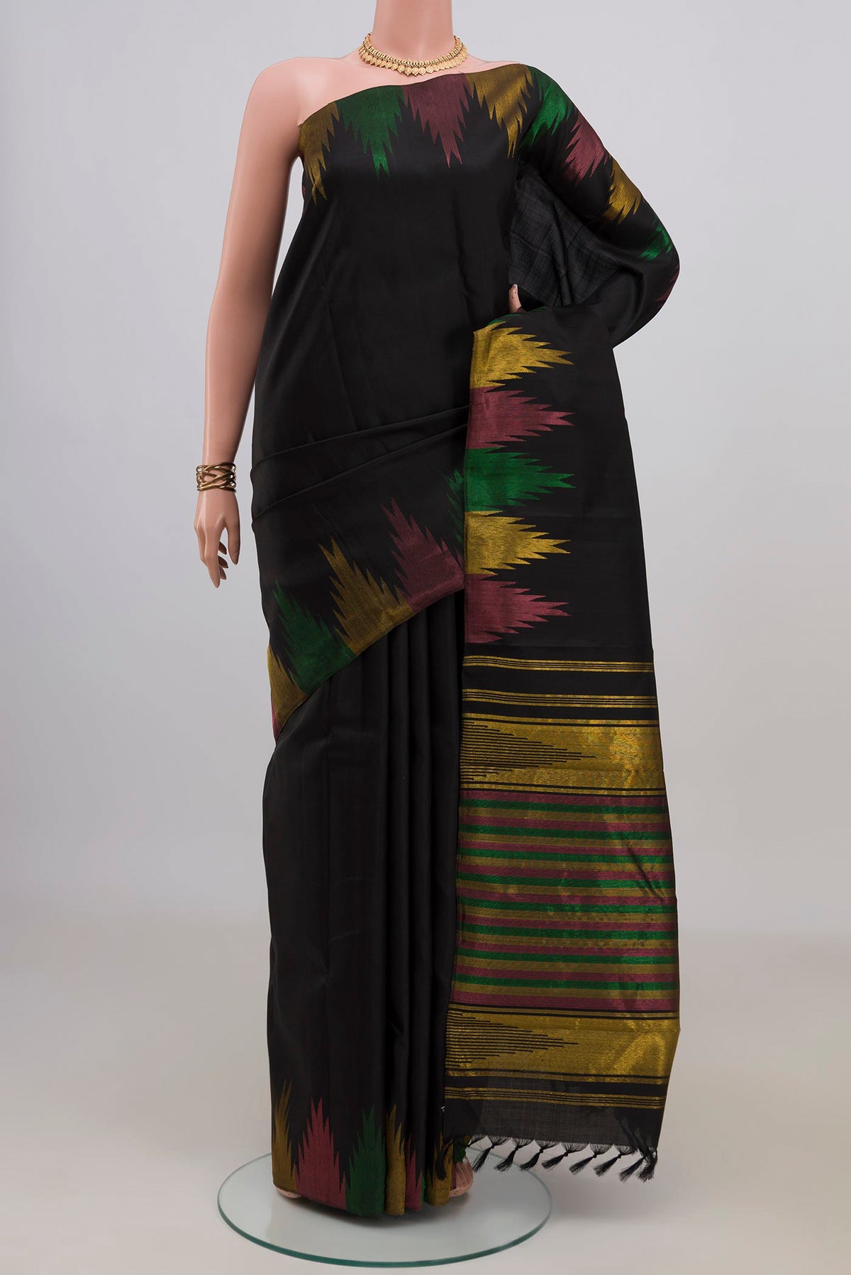 Pure Silk Black Kanjivaram Saree with Plain Body and Temple Border.  displayed on a mannequin