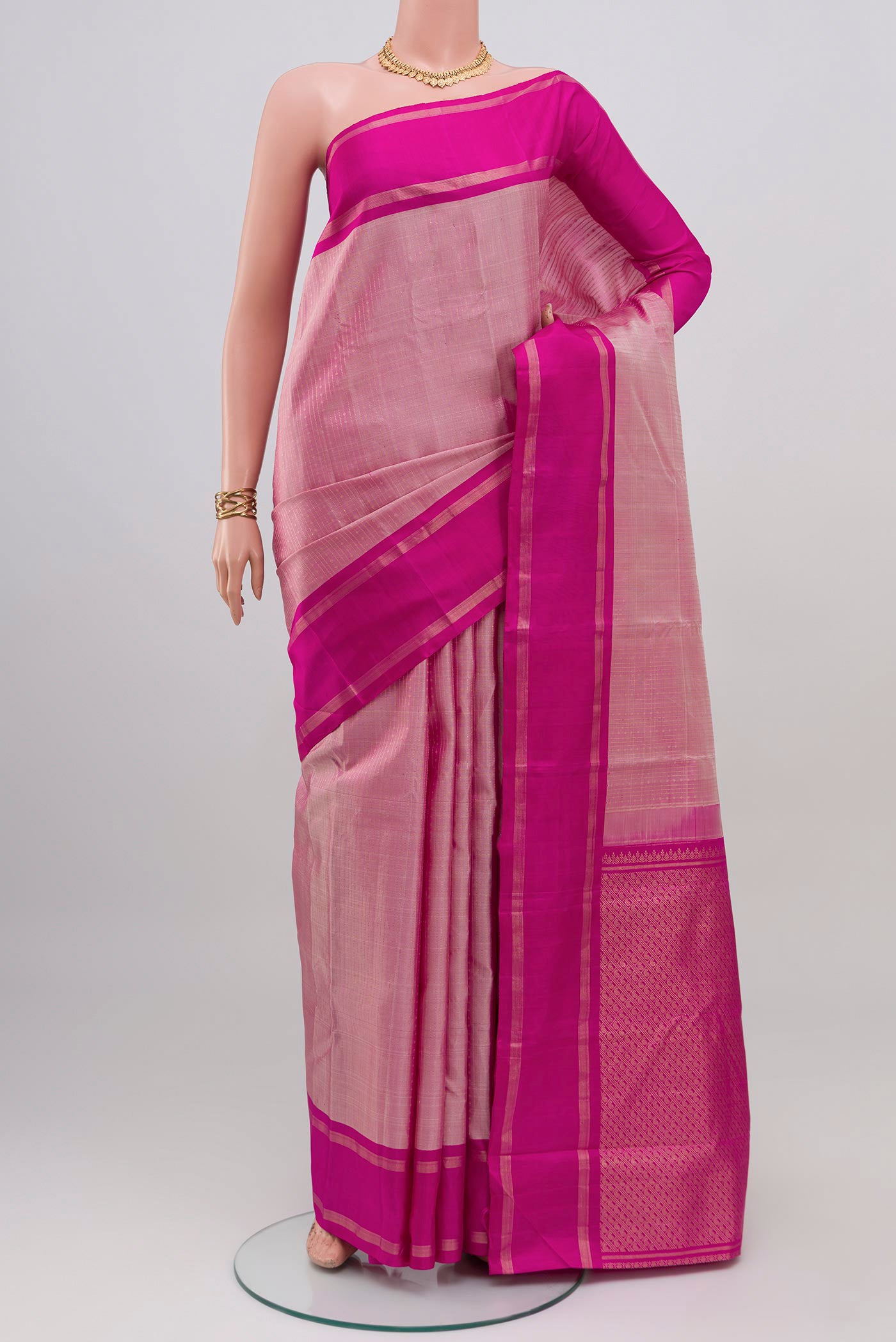 Rose pink Kanchipuram Silk Saree with Stripes on the body and Plain Border.  displayed on a mannequin