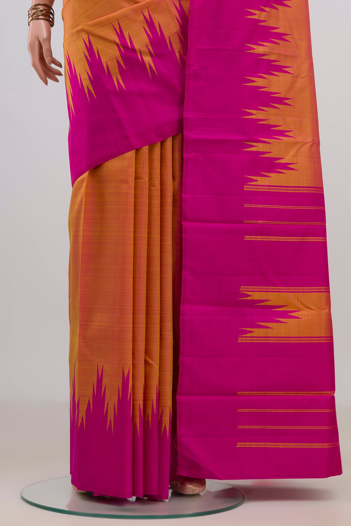 Pleats and pallu of Pure Silk Yellow Kanjivaram Saree with Plain Body and Temple Border. 