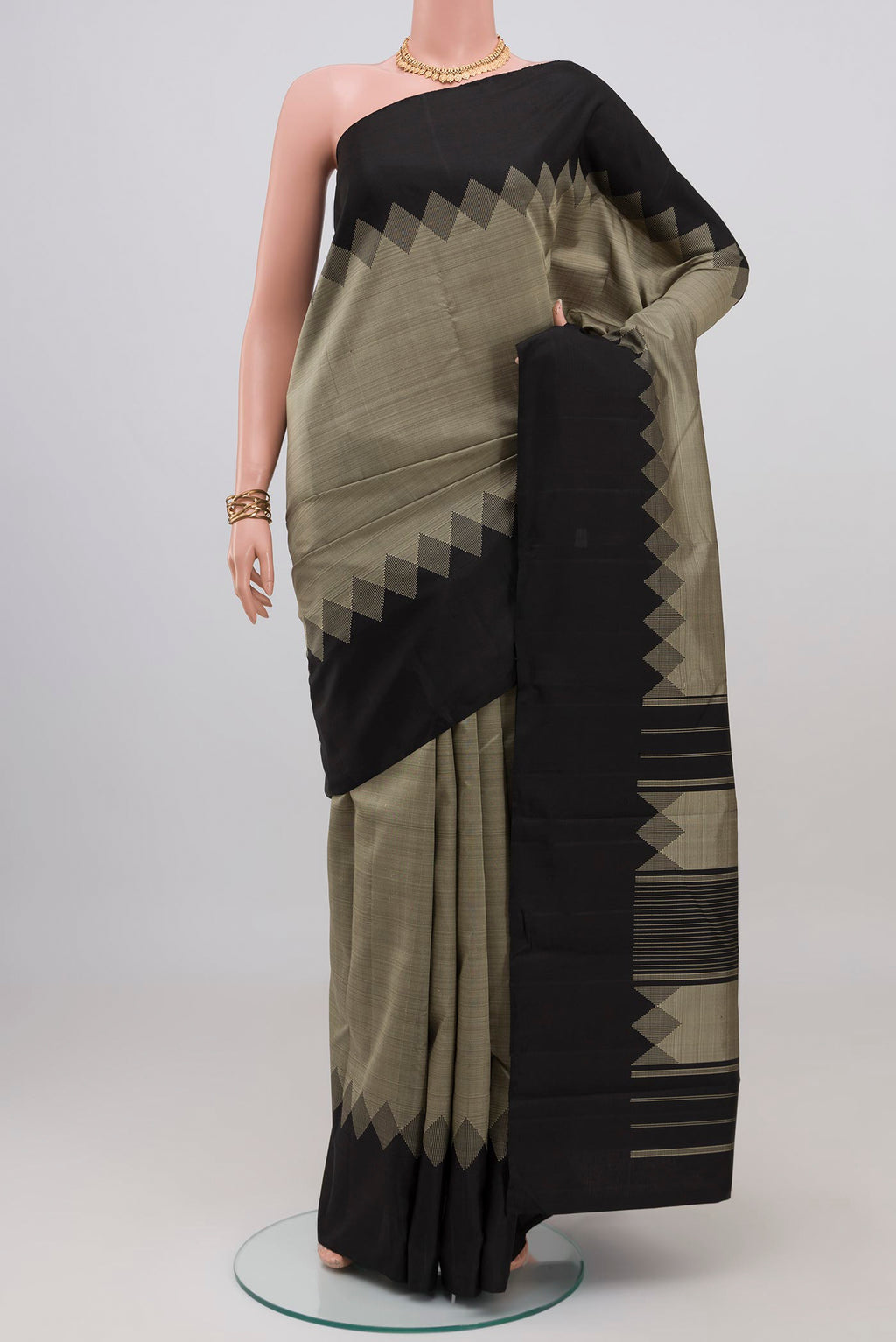 Grey Kanjivaram Silk Saree with Plain Body and Temple Border.  displayed on a mannequin