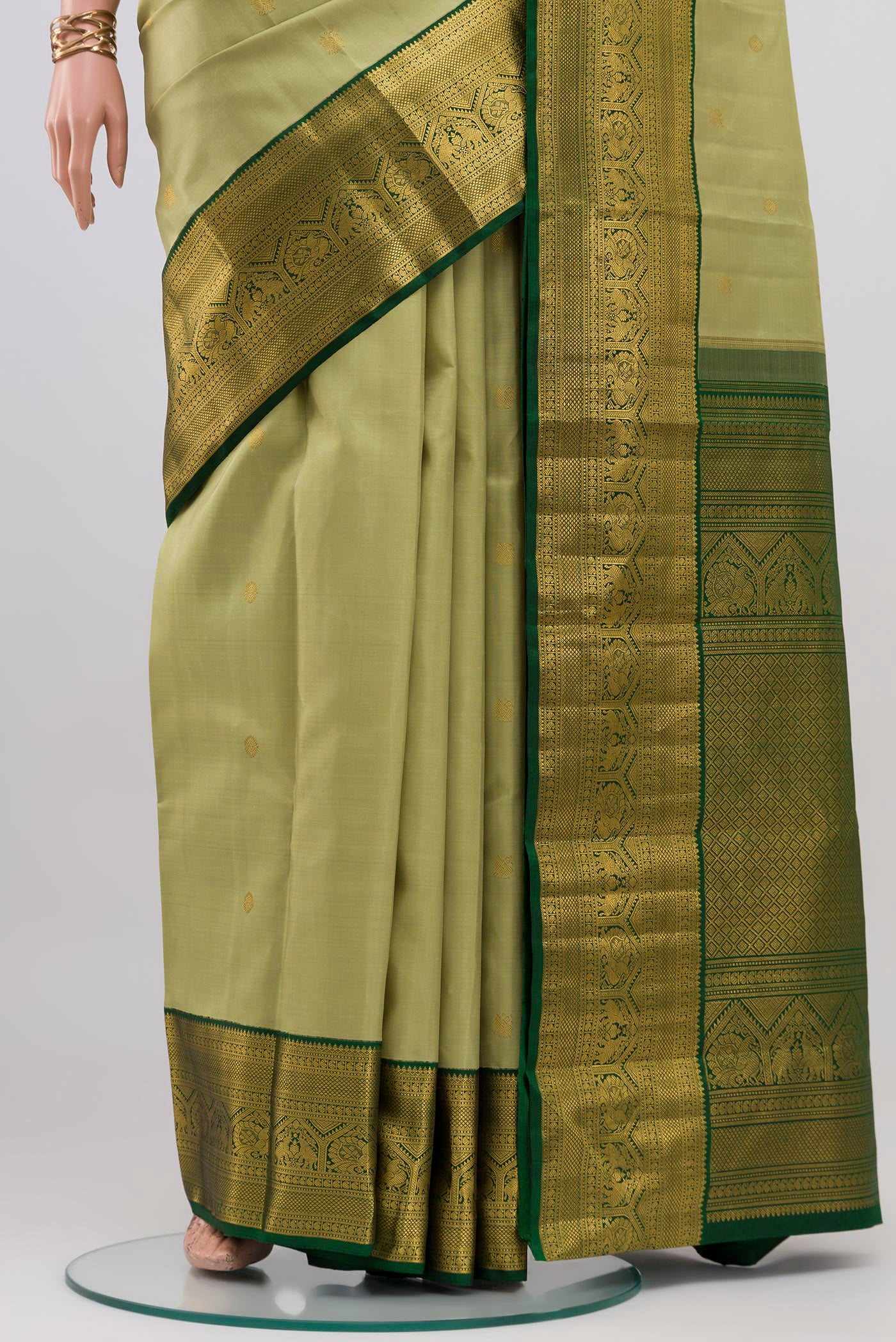 Pleats and pallu of Light Green Kanchipuram Silk Saree with Zari Butta on the body and Zari Border. 