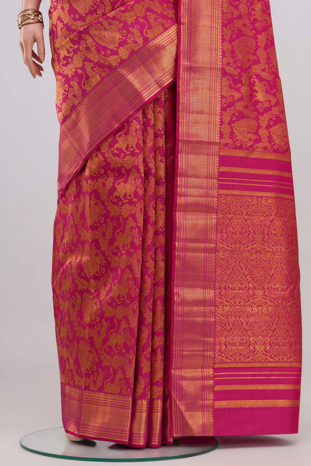Pleats and pallu of Pink Kanchipuram Silk Saree with Zari Brocade on the body and Zari Border. 