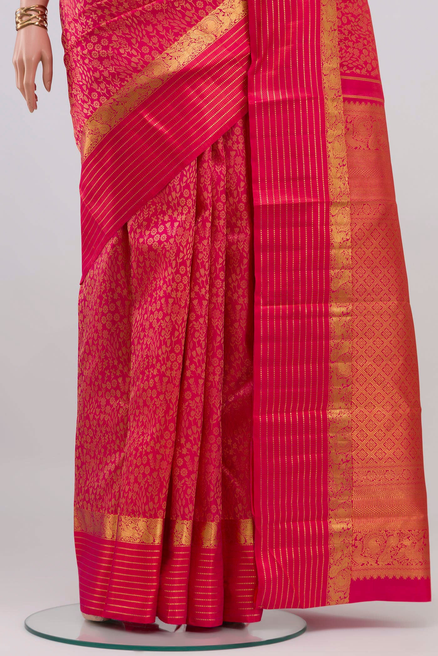 Pleats and pallu of Pink Kanjivaram Silk Saree with Jacquard design on the body and Zari Border. 