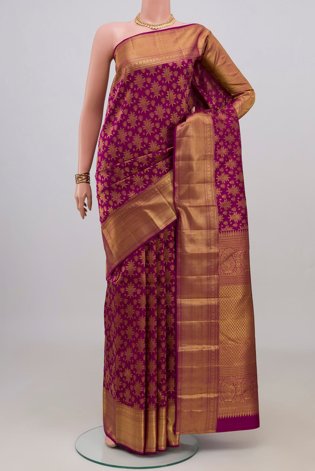 Purple Kanchipuram Silk Saree with Zari Brocade on the body and Zari Border.  displayed on a mannequin