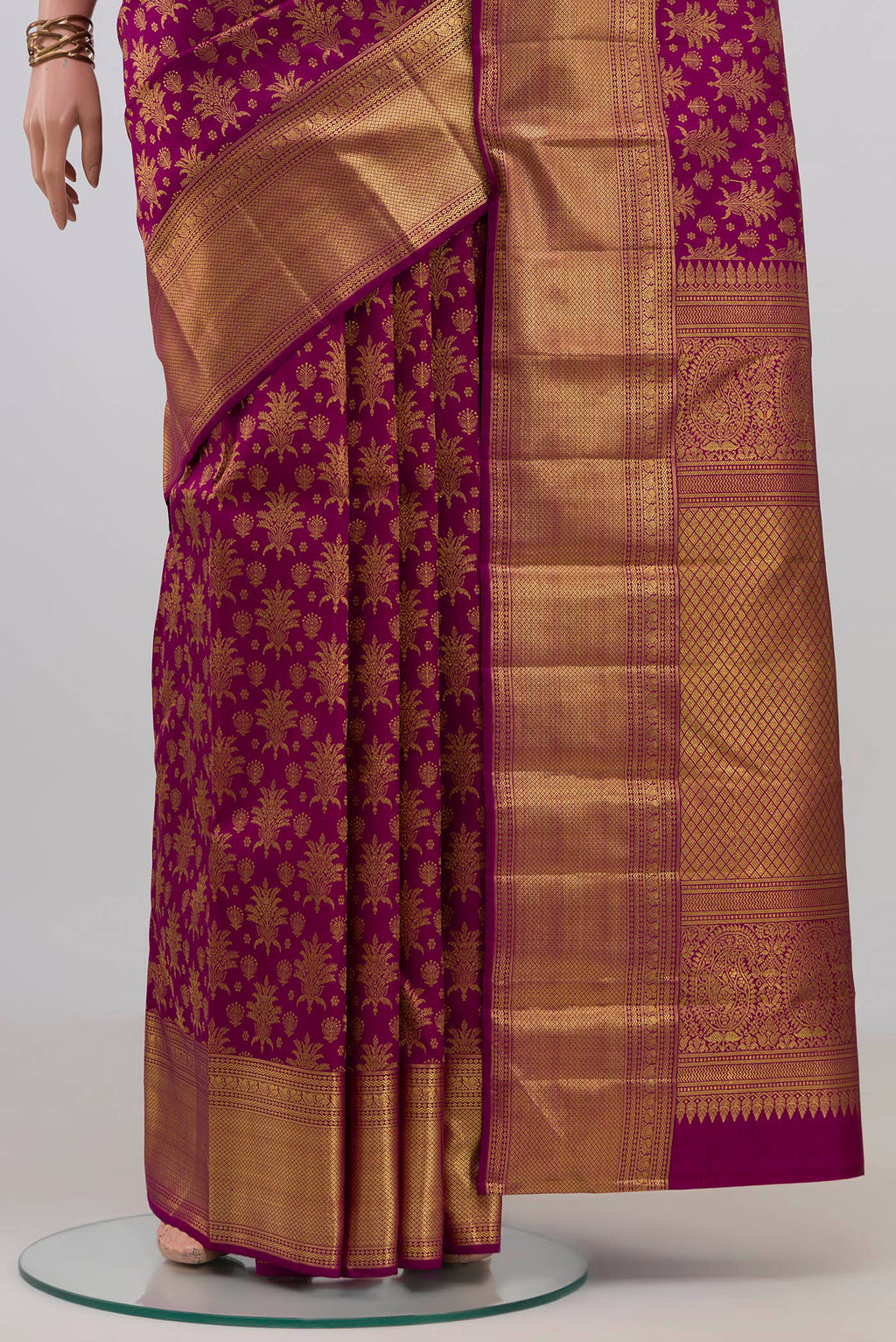 Pleats and pallu of Purple Kanchipuram Silk Saree with Zari Brocade on the body and Zari Border. 