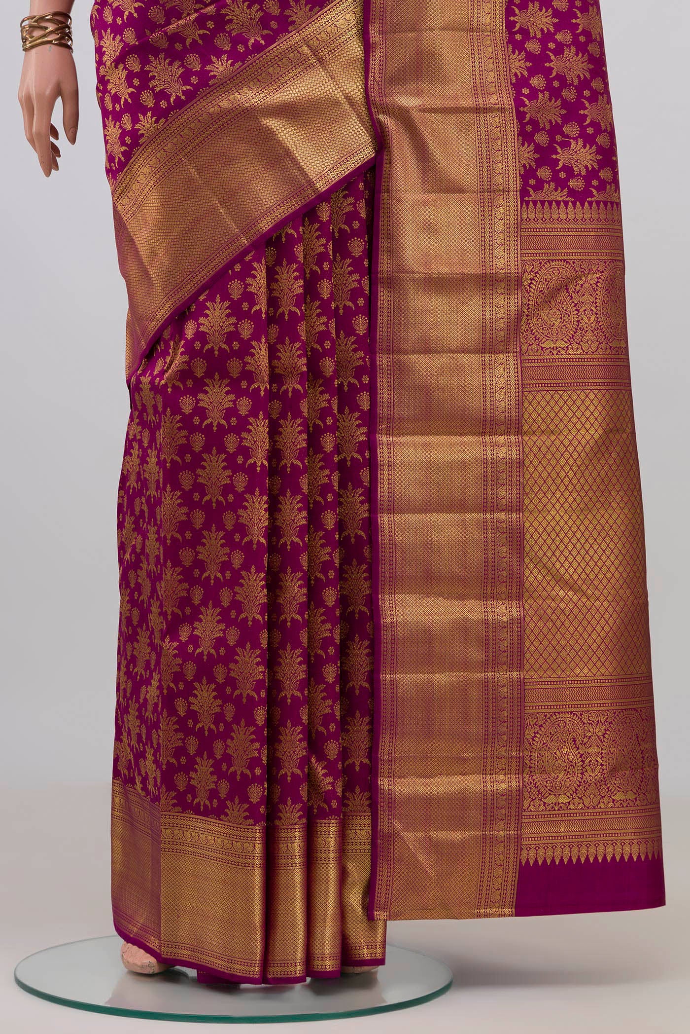 Pleats and pallu of Purple Kanchipuram Silk Saree with Zari Brocade on the body and Zari Border. 