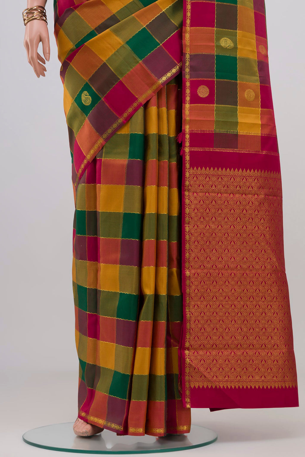 Pleats and pallu of Multi Color Kanchipuram Silk Saree with Checked design on the body and Thin Zari Line. 