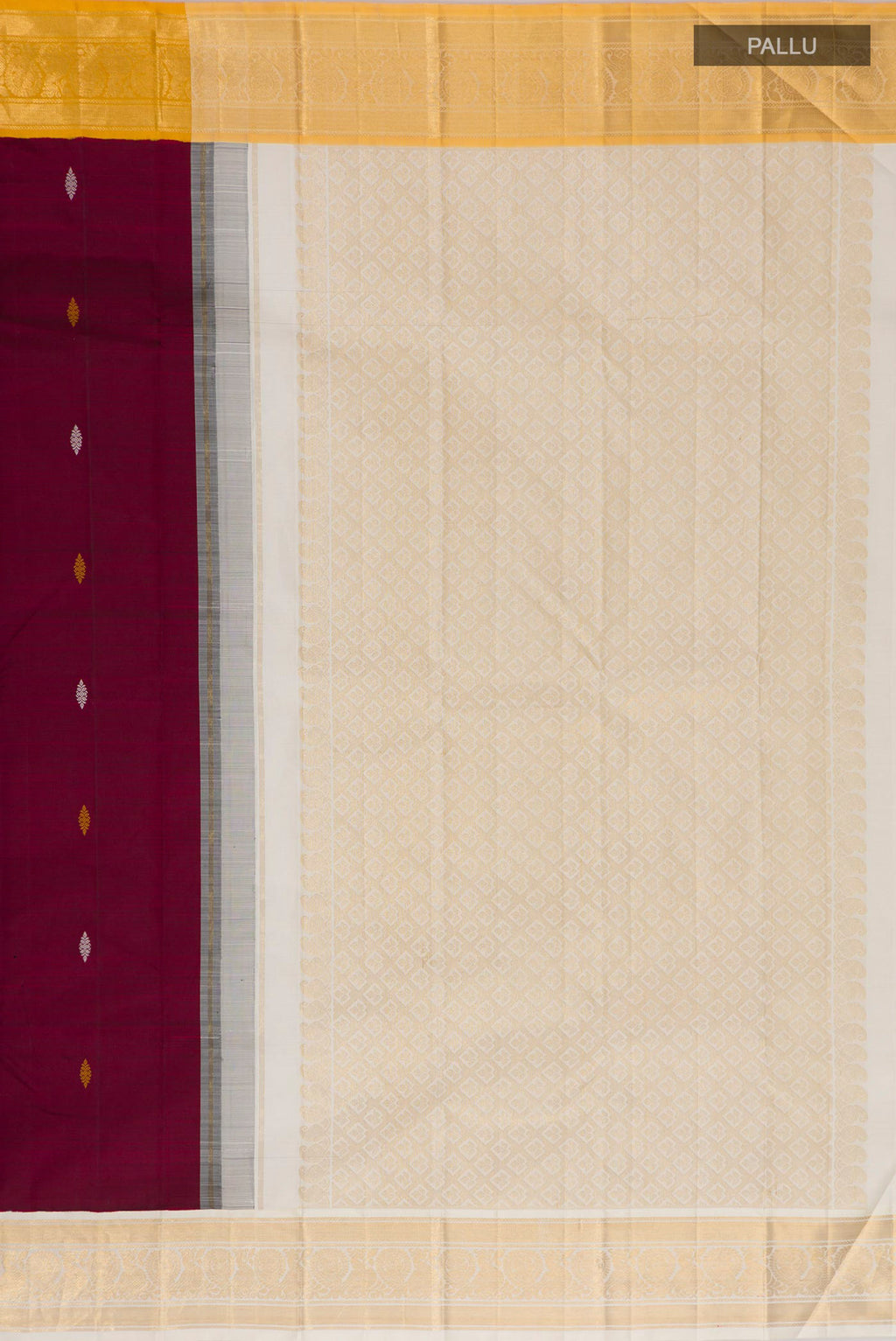 Close up image of the pallu of Maroon Kanjivaram Silk Saree with Thread Butta on the body and Ganga Jamuna Border. 