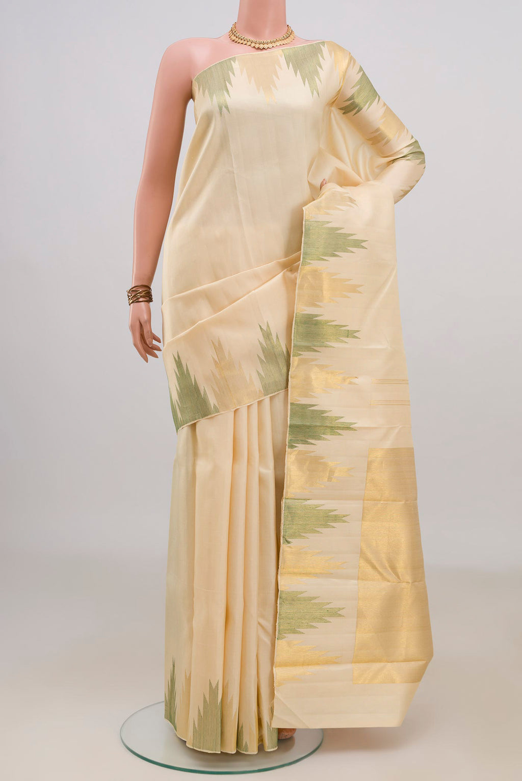 Pure Silk Cream Kanjivaram Saree with Plain Body and Temple Border.  displayed on a mannequin