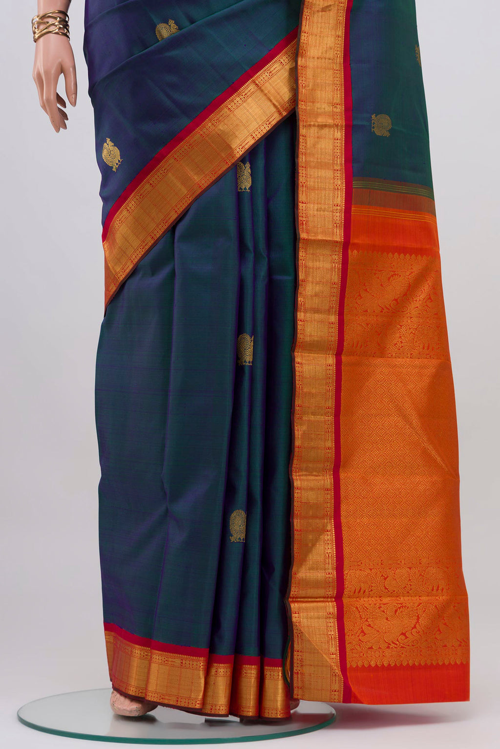 Pleats and pallu of Peacock Blue Kanjivaram Silk Saree with Zig Zag design on the body and Zari Border. 
