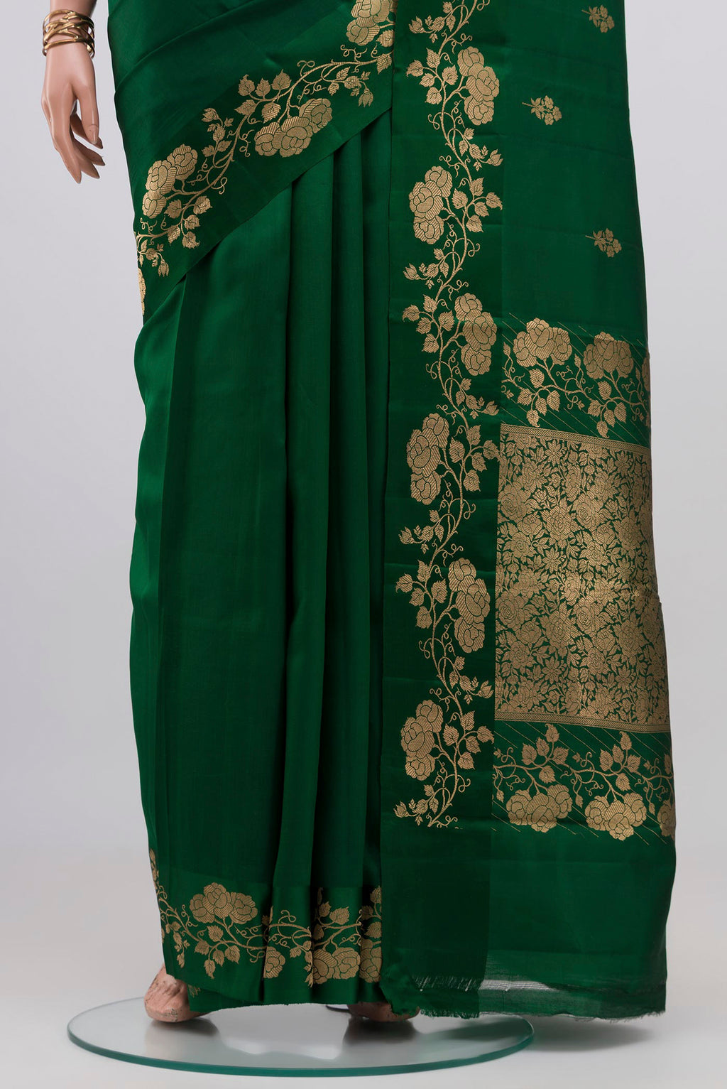 Pleats and pallu of Bottle Green Banarasi Katan Silk Saree with Zari Butta on the body and Fancy Border. 