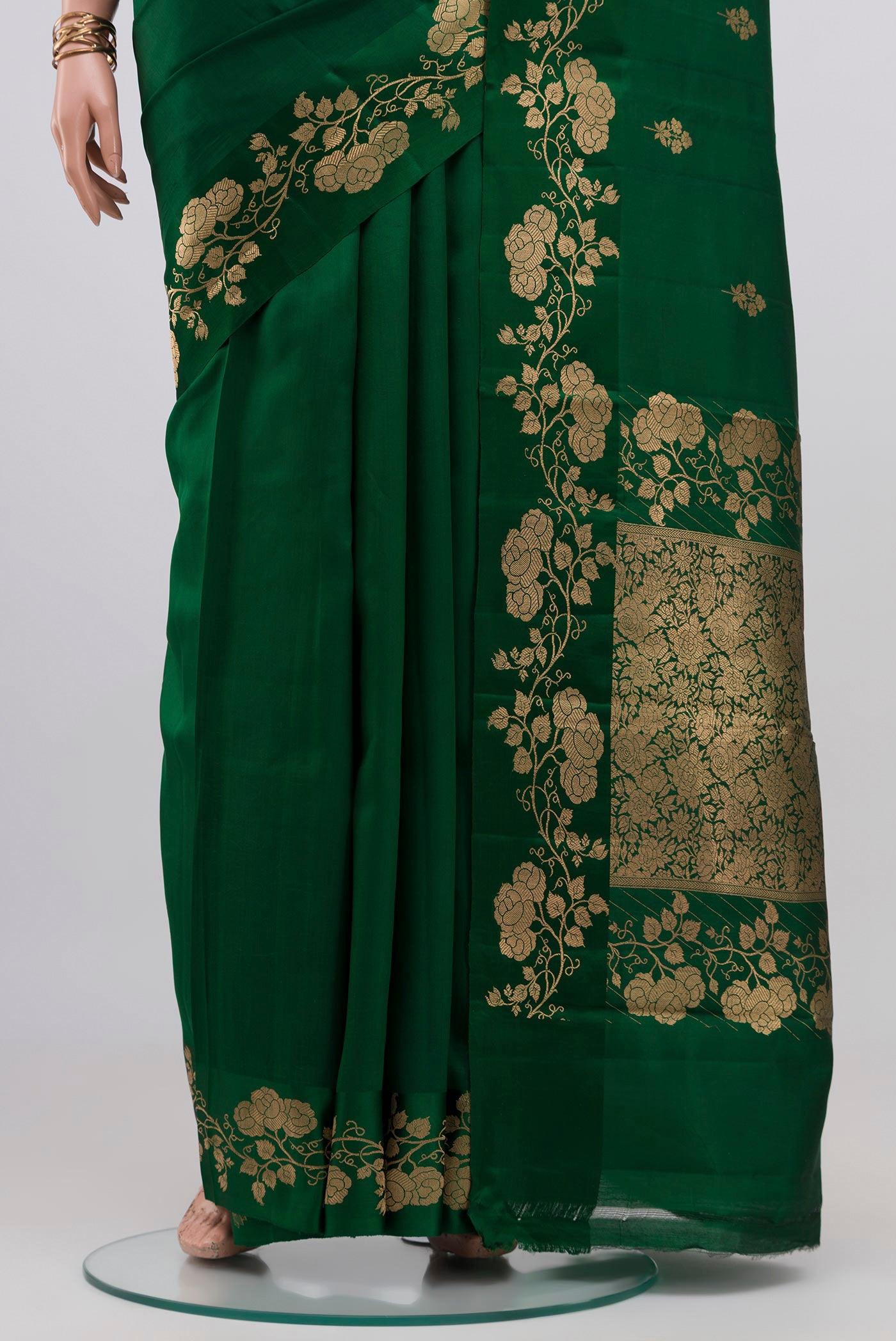 Pleats and pallu of Bottle Green Banarasi Katan Silk Saree with Zari Butta on the body and Fancy Border. 