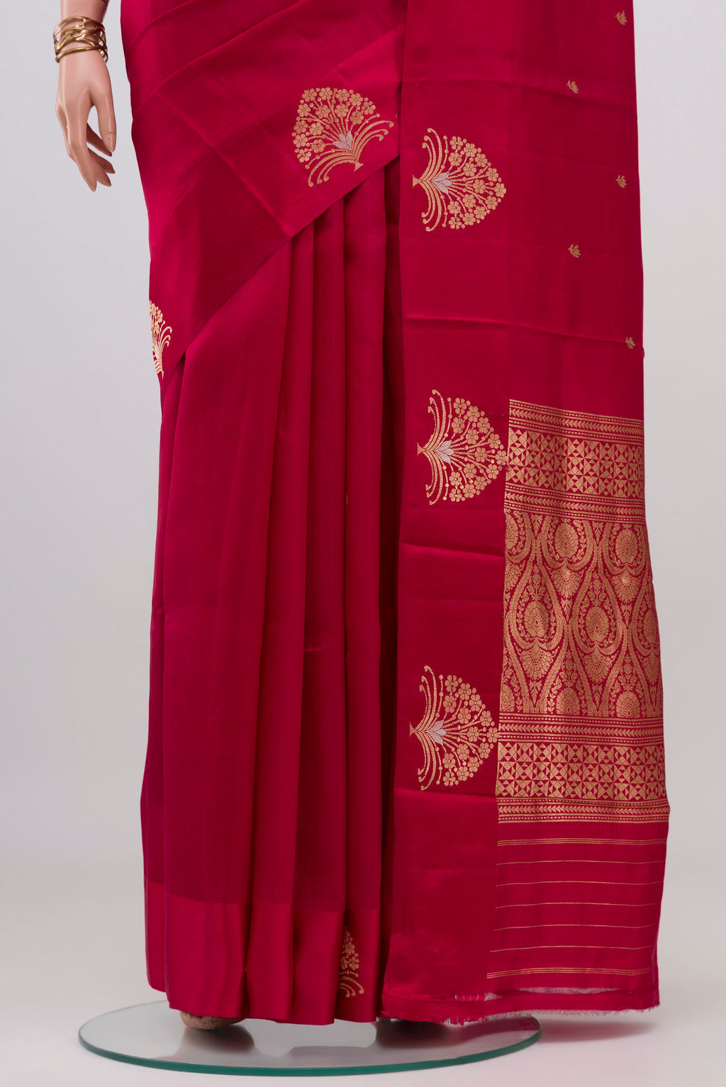 Pleats and pallu of Maroon Banarasi Katan Silk Saree with Zari Butta on the body and Fancy Border. 