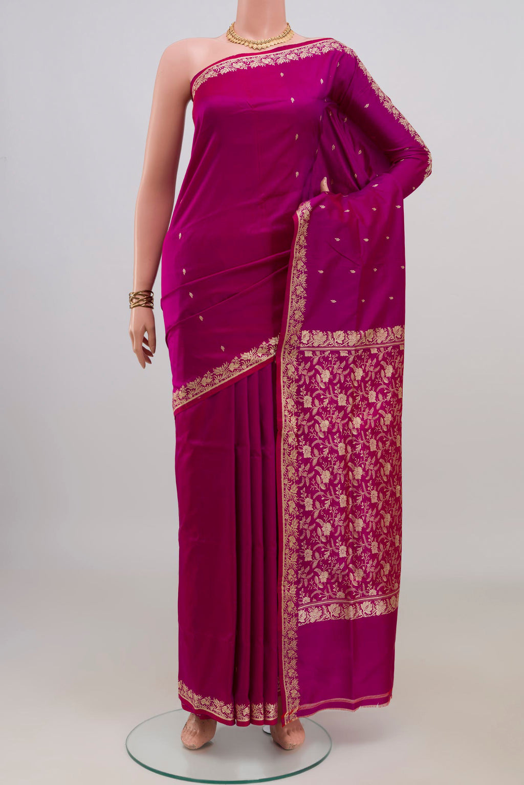 Pure Silk Magenta Banarasi Katan Saree with Thread Butta on the body and Thread Border.  displayed on a mannequin