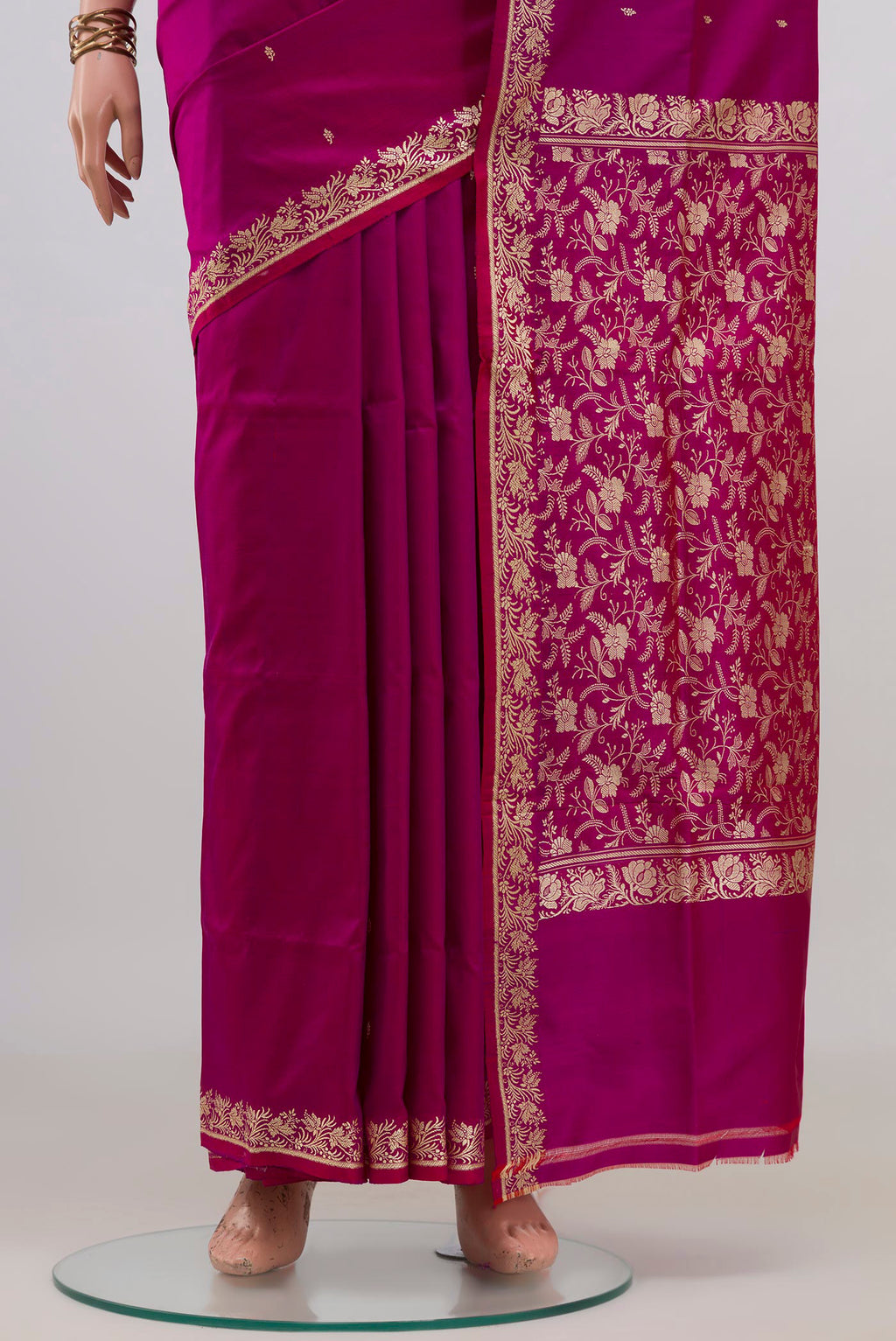 Pleats and pallu of Pure Silk Magenta Banarasi Katan Saree with Thread Butta on the body and Thread Border. 