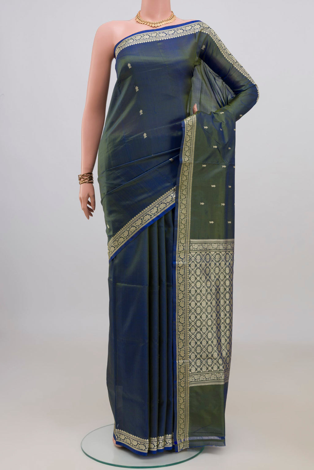 Pure Silk Blue with Green Color Banarasi Katan Saree with Thread Butta on the body and Thread Border.  displayed on a mannequin