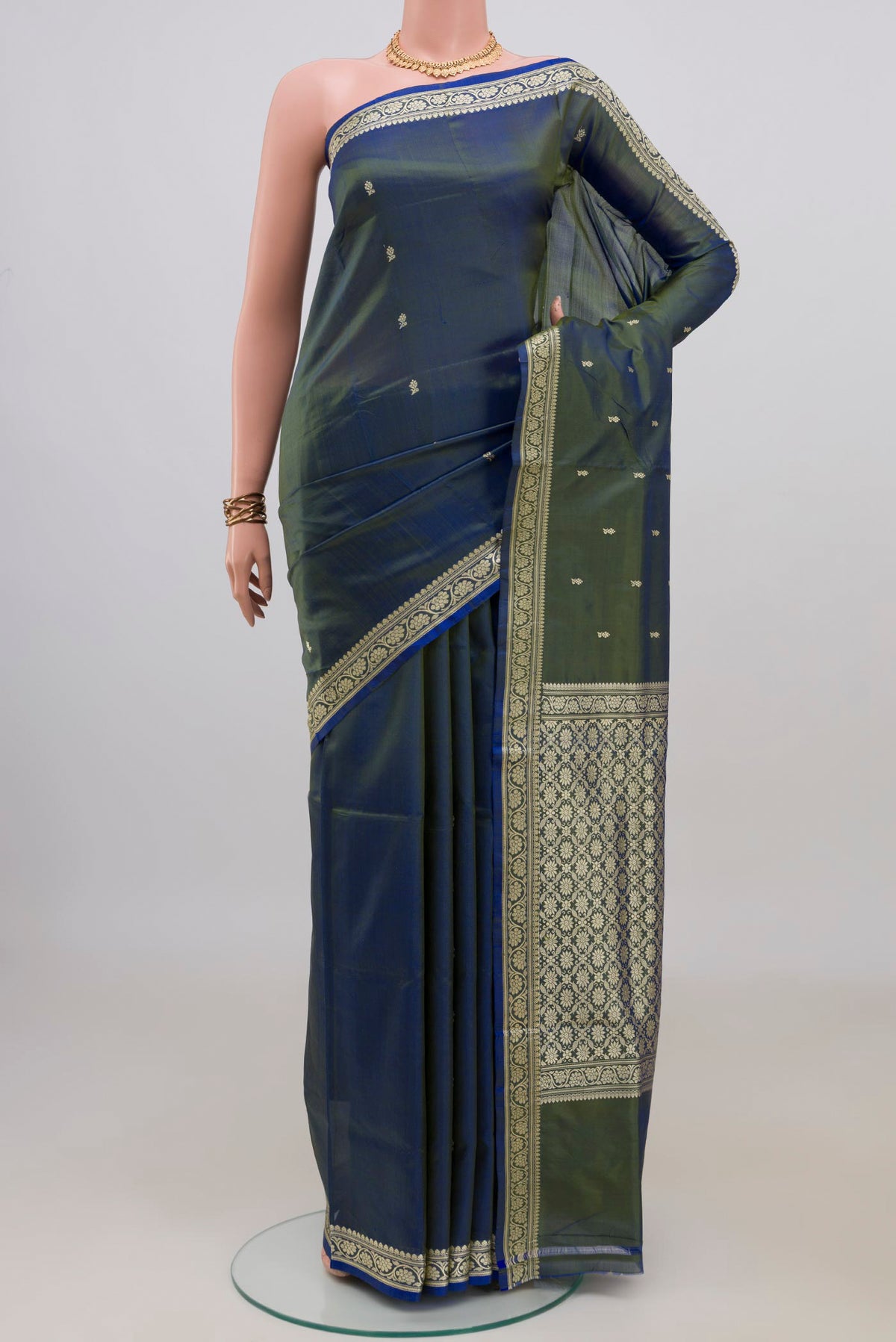 Pure Silk Blue with Green Color Banarasi Katan Saree with Thread Butta on the body and Thread Border.  displayed on a mannequin