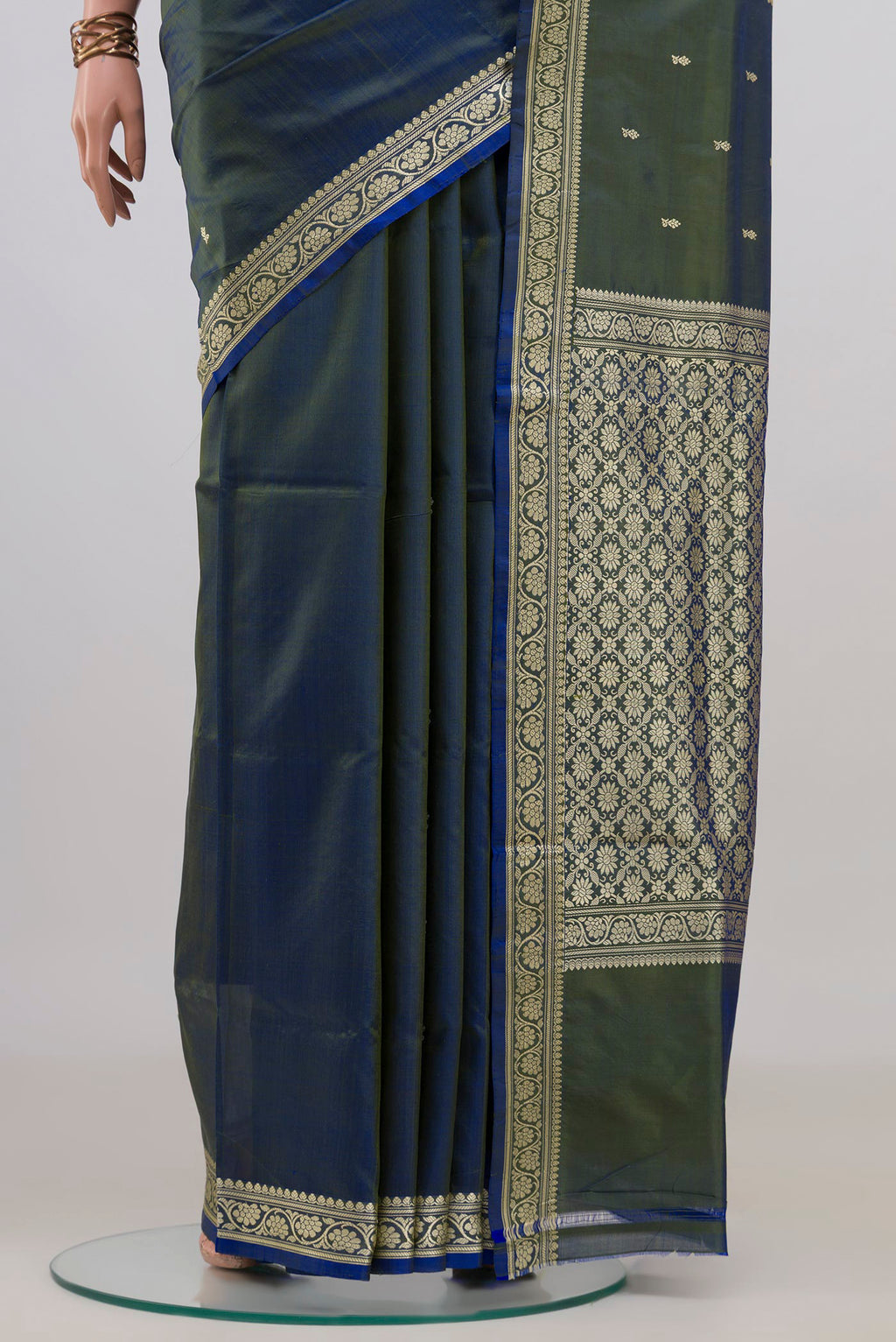 Pleats and pallu of Pure Silk Blue with Green Color Banarasi Katan Saree with Thread Butta on the body and Thread Border. 