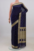 Pure Silk Navy Blue Banarasi Katan Saree with Thread Butta on the body and Thread Border.  displayed on a mannequin