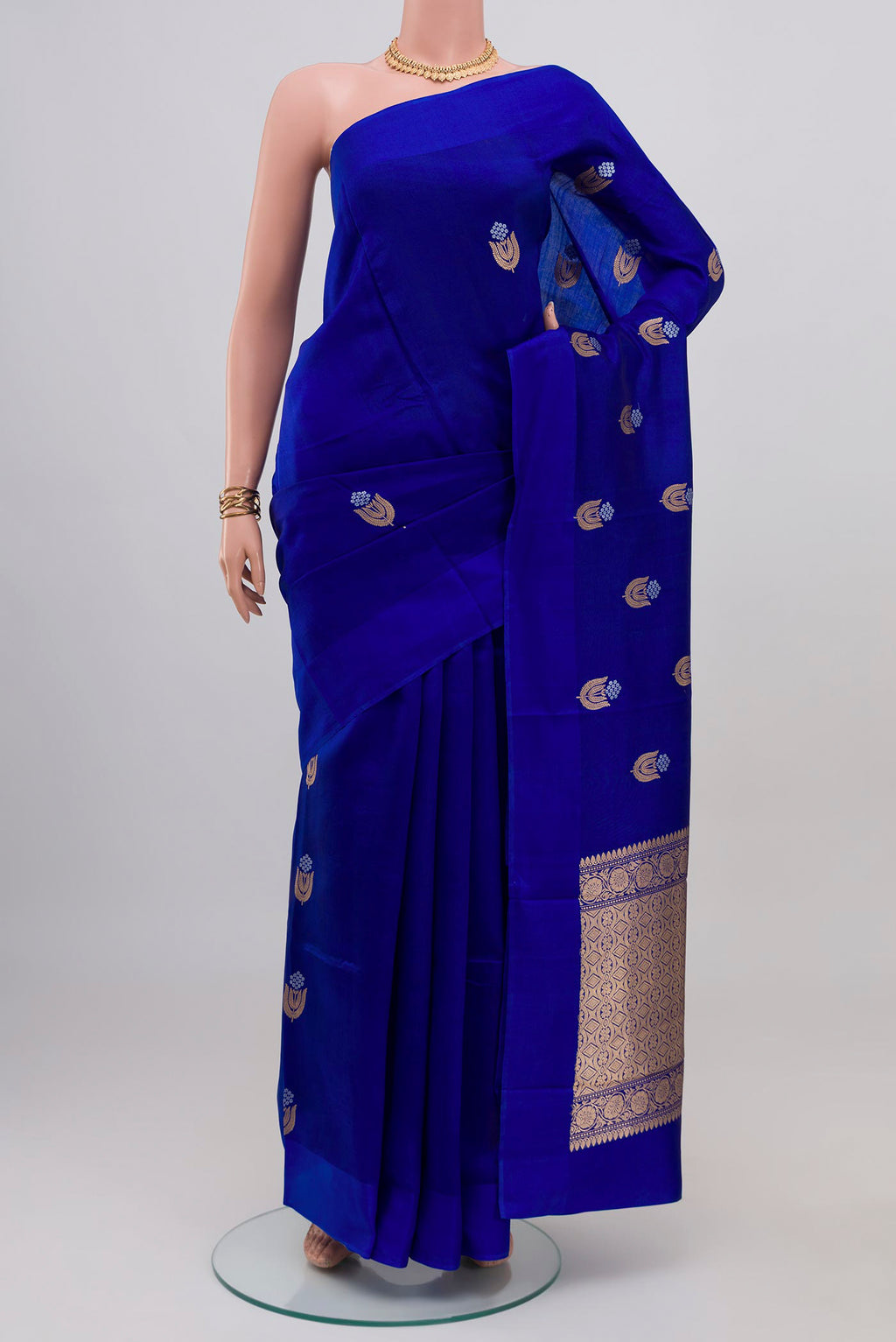 Royal Blue Banarasi Katan Silk Saree with Zari Butta on the body and Plain Border.  displayed on a mannequin