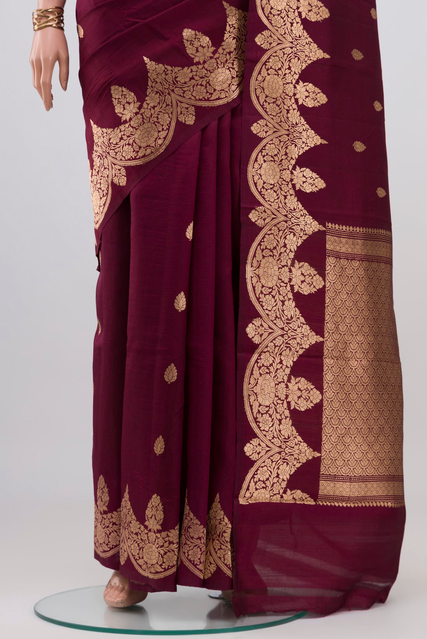 Pleats and pallu of Burgundy Banarasi Katan Silk Saree with Zari Butta on the body and Fancy Border. 