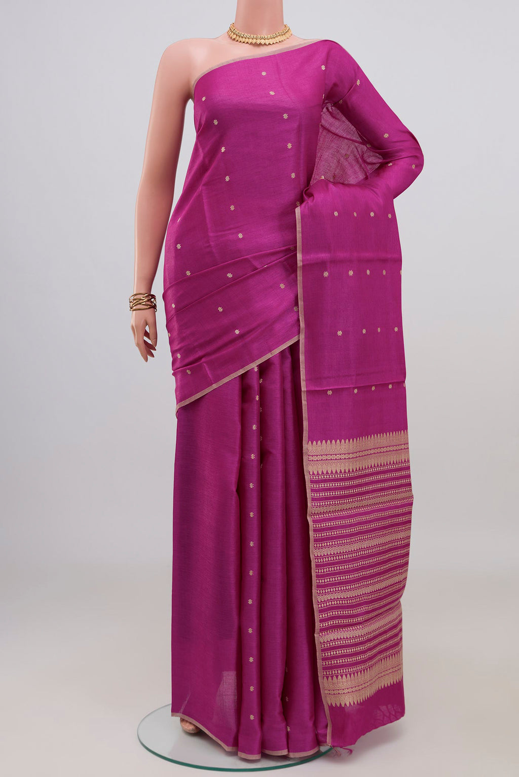 Magenta Tussar Silk Saree with Thread Butta on the body and Plain Border.  displayed on a mannequin