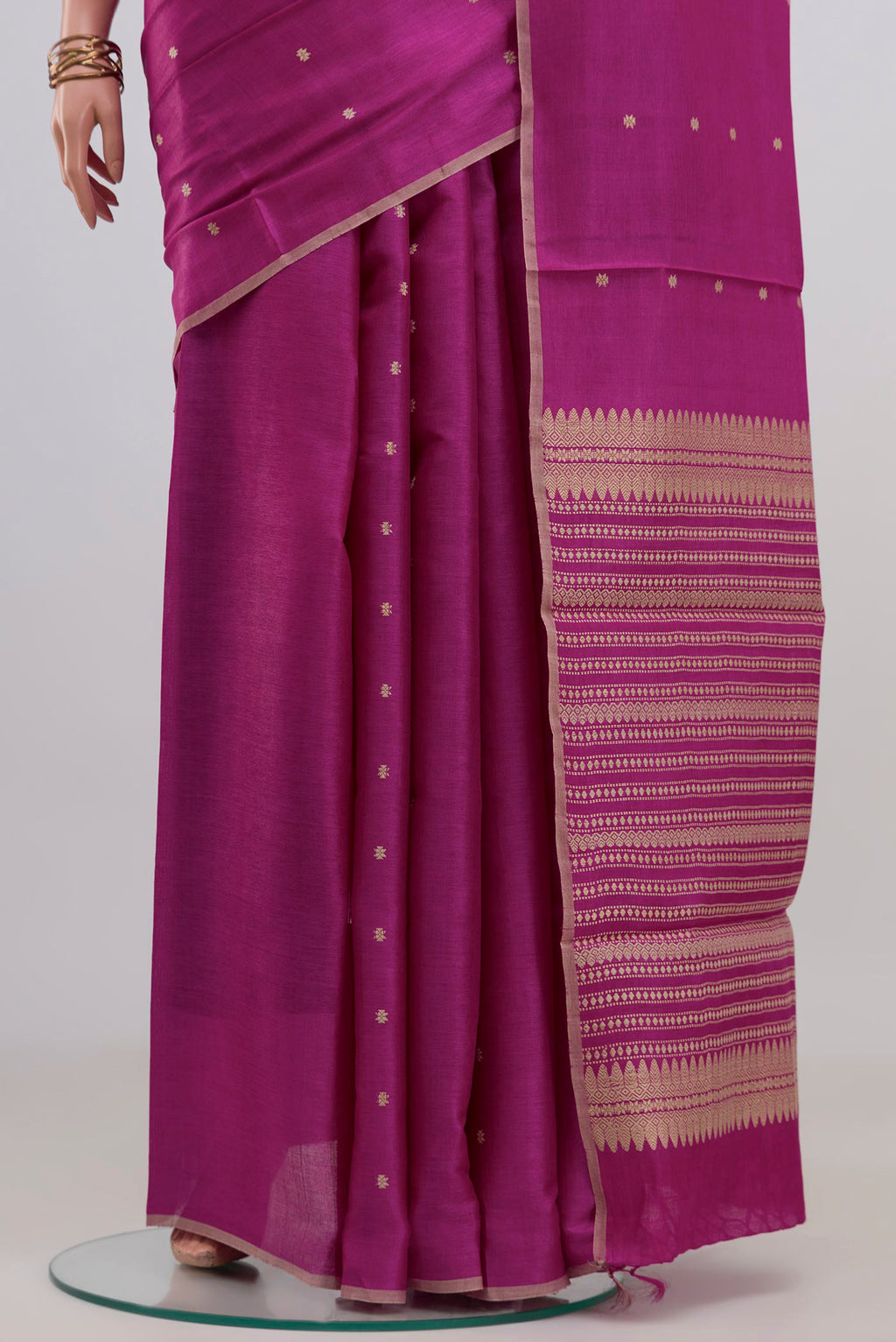 Pleats and pallu of Magenta Tussar Silk Saree with Thread Butta on the body and Plain Border. 