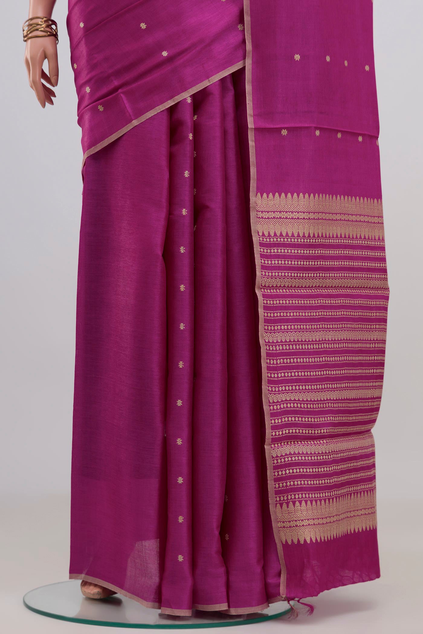 Pleats and pallu of Magenta Tussar Silk Saree with Thread Butta on the body and Plain Border. 