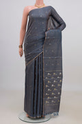 Blue Grey Tussar Saree with Zari Butta on the body and Thin Zari Line.  displayed on a mannequin
