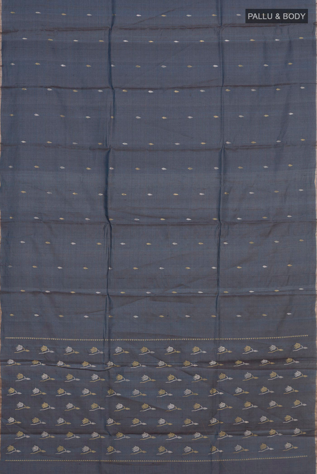 Flat view of Blue Grey Tussar Saree with Zari Butta on the body and Thin Zari Line. 