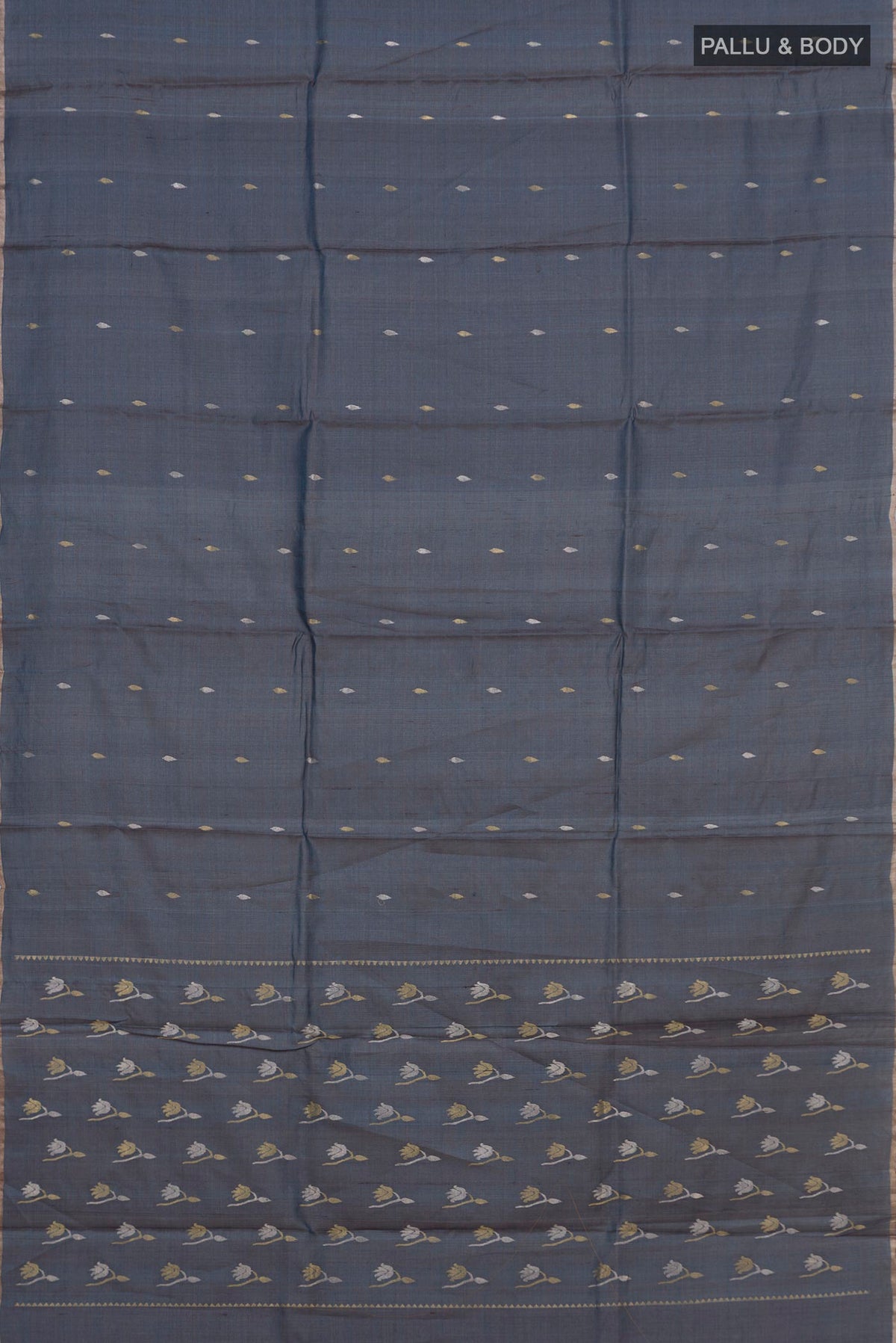 Flat view of Blue Grey Tussar Saree with Zari Butta on the body and Thin Zari Line. 