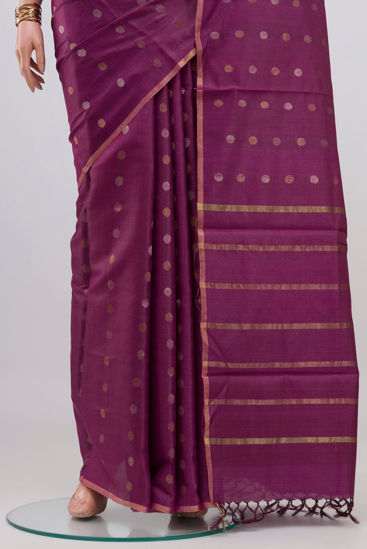 Pleats and pallu of Purple Tussar Silk Saree with Zari Butta on the body and Thin Zari Line. 