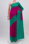 Magenta Tussar Silk Saree with Plain Body and Fancy Border.  displayed on a mannequin