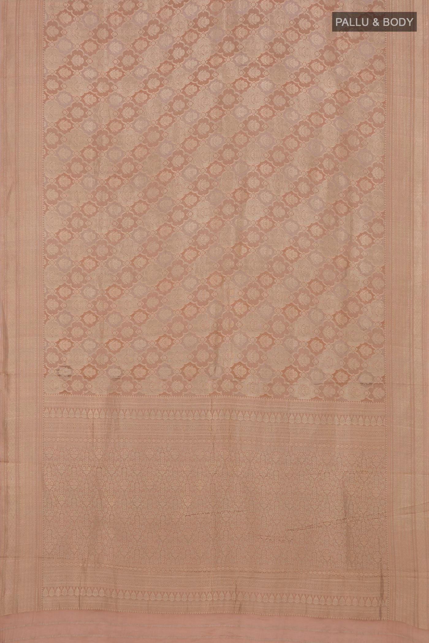 Flat view of Rose Gold Crepe Saree with Zari Brocade on the body and Zari Border. 