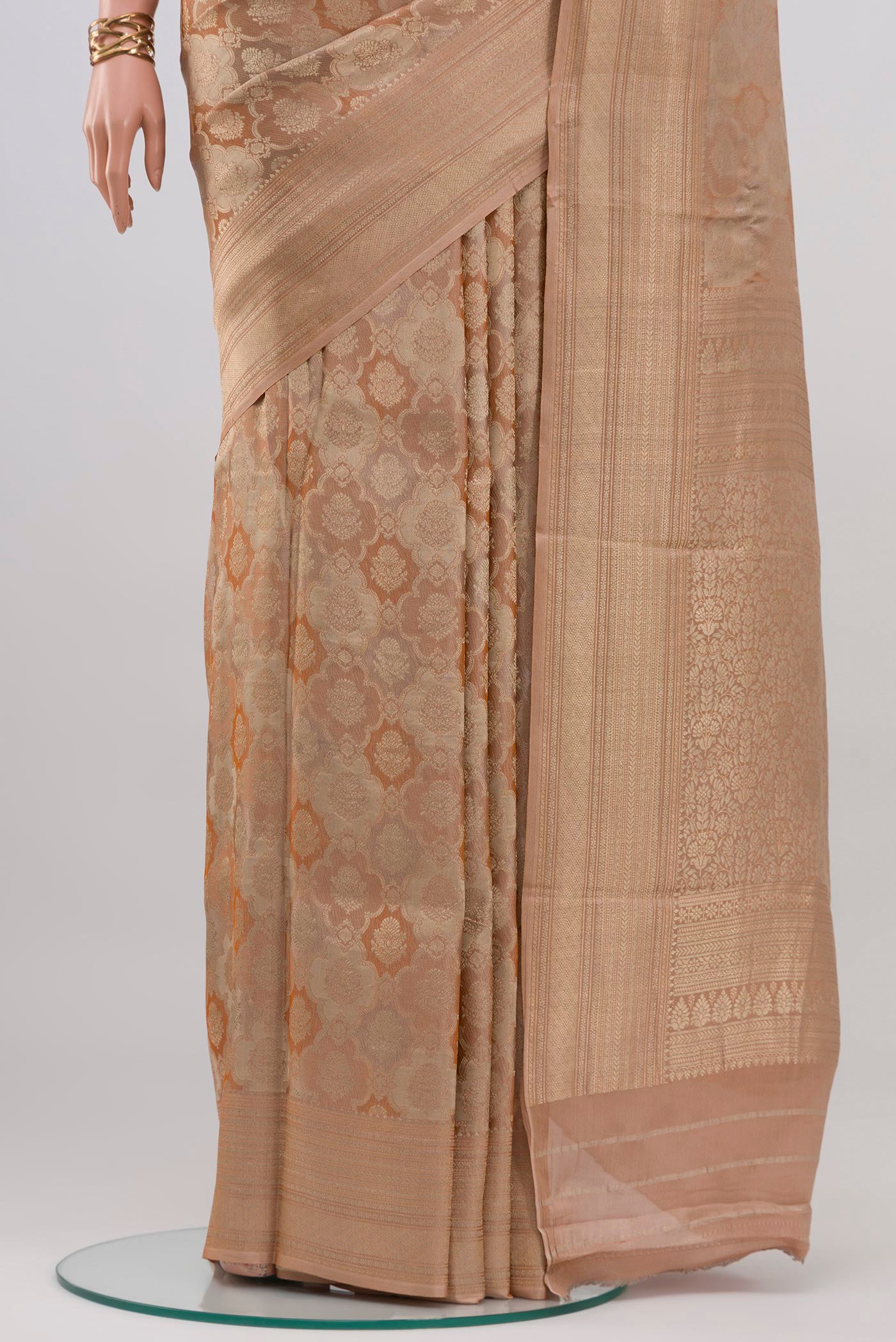 Pleats and pallu of Rose Gold Crepe Saree with Zari Brocade on the body and Zari Border. 