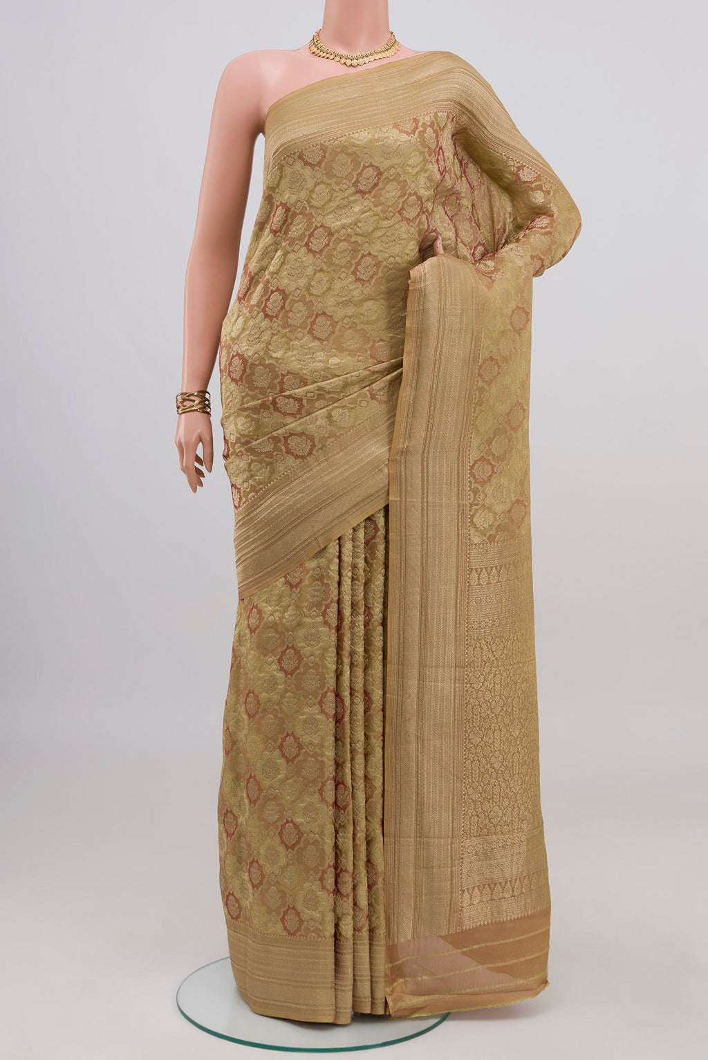 Beige Mysore Crepe Saree with Zari Brocade on the body and Zari Border.  displayed on a mannequin