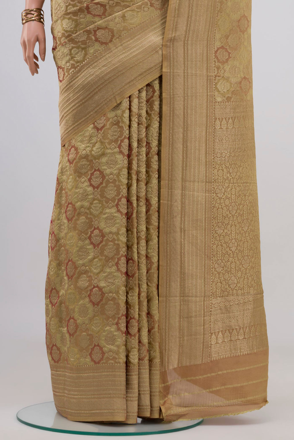 Pleats and pallu of Beige Mysore Crepe Saree with Zari Brocade on the body and Zari Border. 