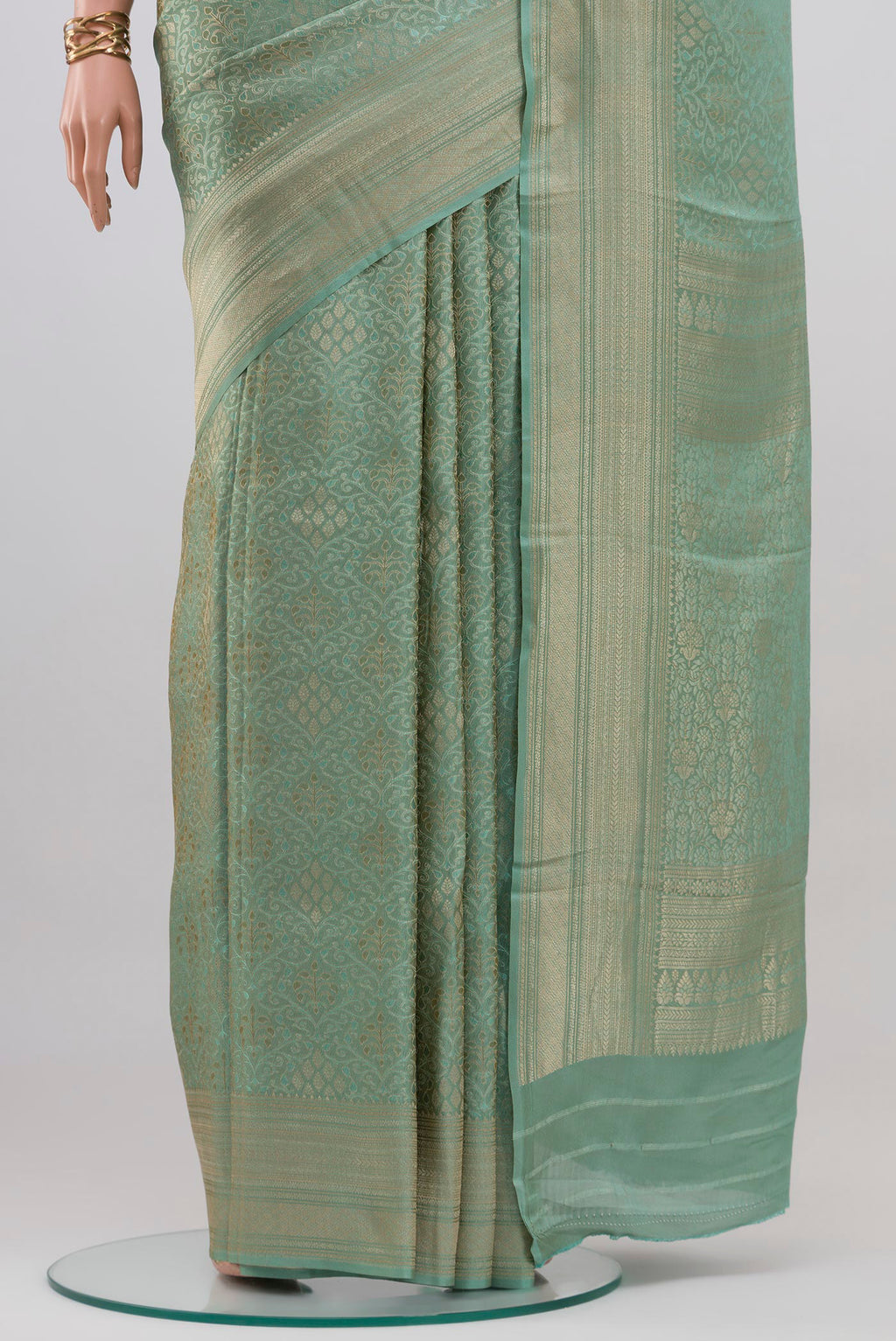 Pleats and pallu of Light Blue Crepe Saree with Zari Brocade on the body and Fancy Border. 