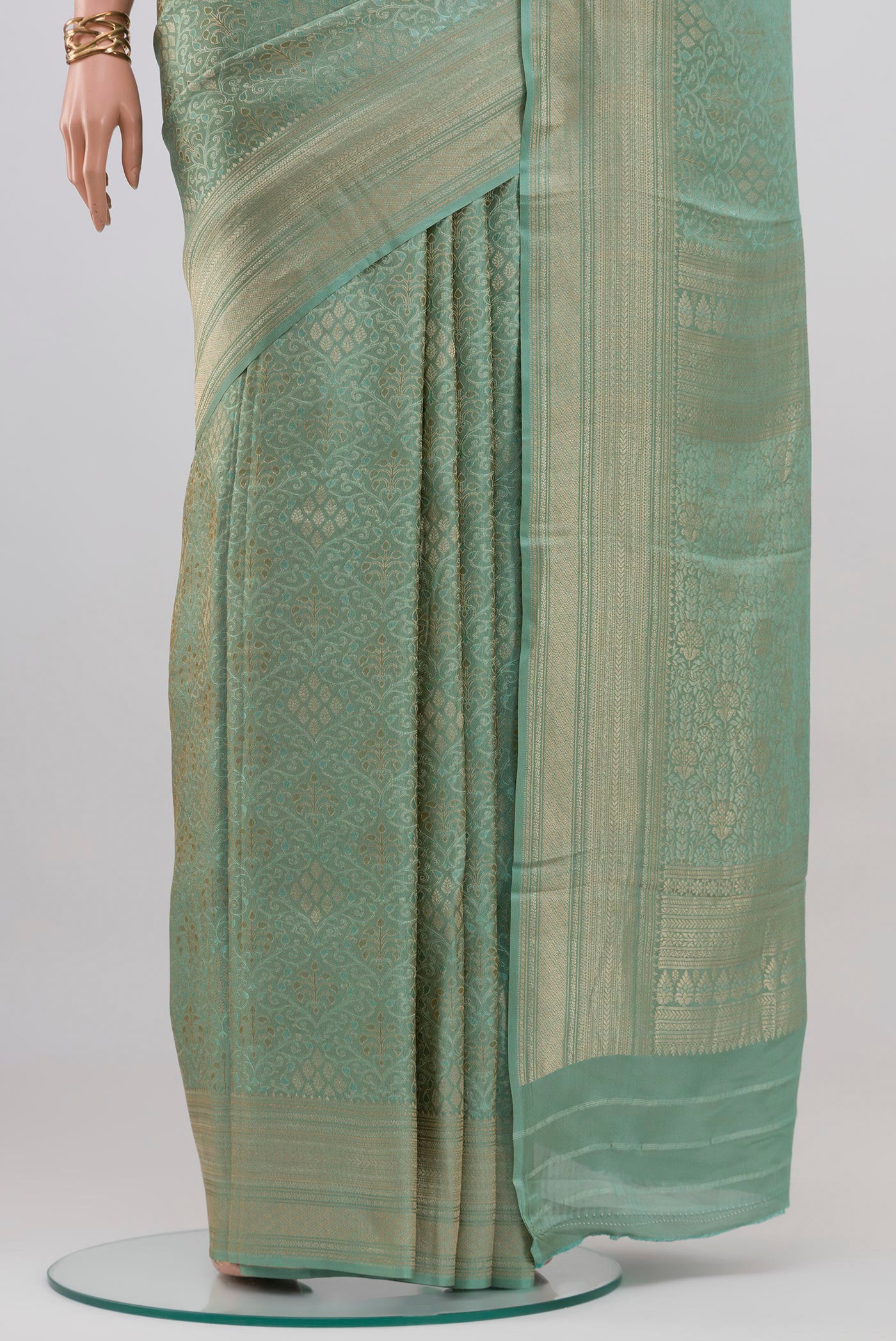 Pleats and pallu of Light Blue Crepe Saree with Zari Brocade on the body and Fancy Border. 