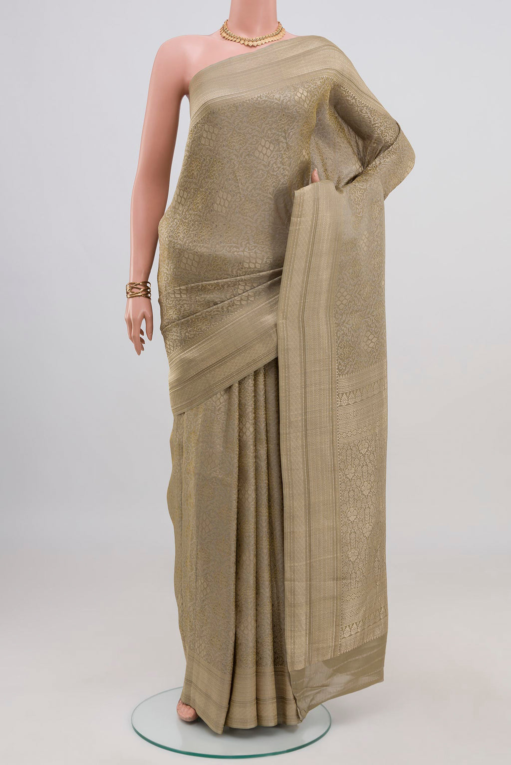 Green Crepe Saree with Fancy on the body and Fancy Border.  displayed on a mannequin
