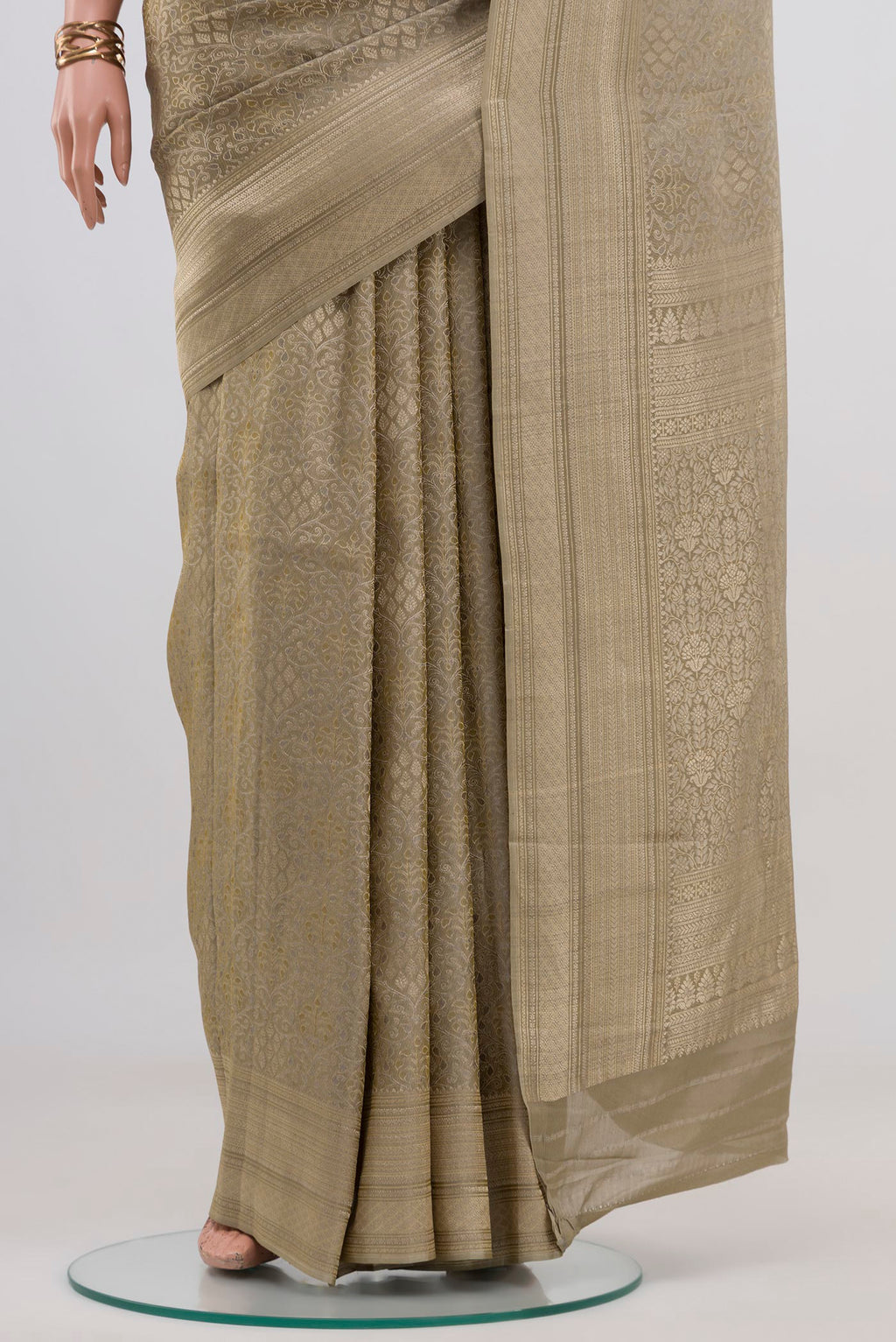 Pleats and pallu of Green Crepe Saree with Fancy on the body and Fancy Border. 