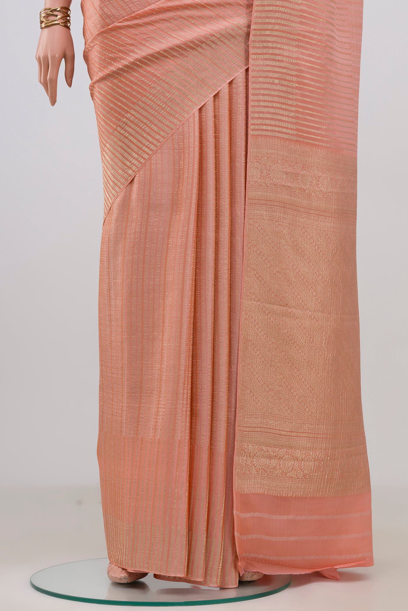 Pleats and pallu of Peach Mysore Crepe Saree with Stripes on the body and Without Border. 
