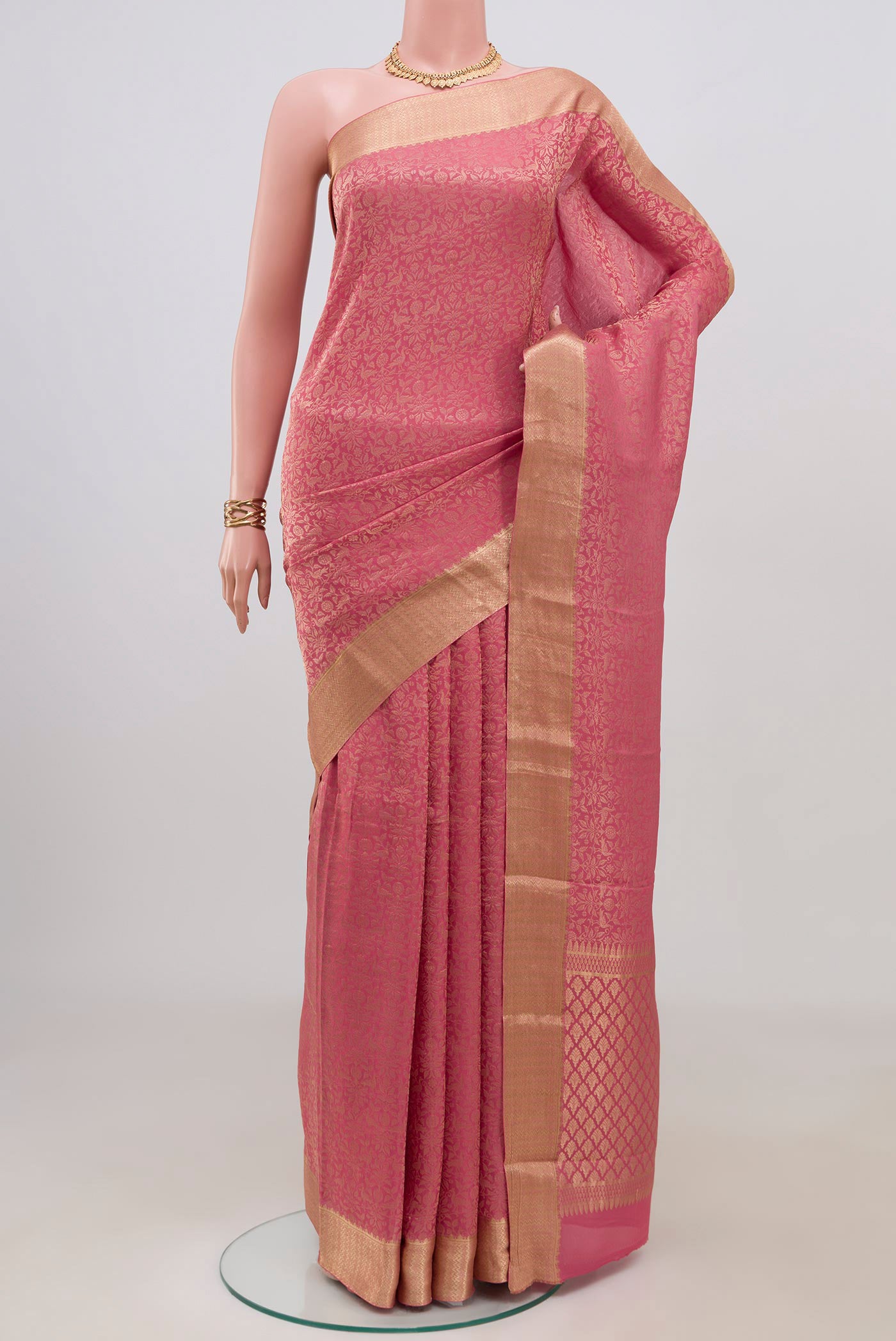 Pink Mysore Crepe Saree with Zari Brocade on the body and Zari Border.  displayed on a mannequin